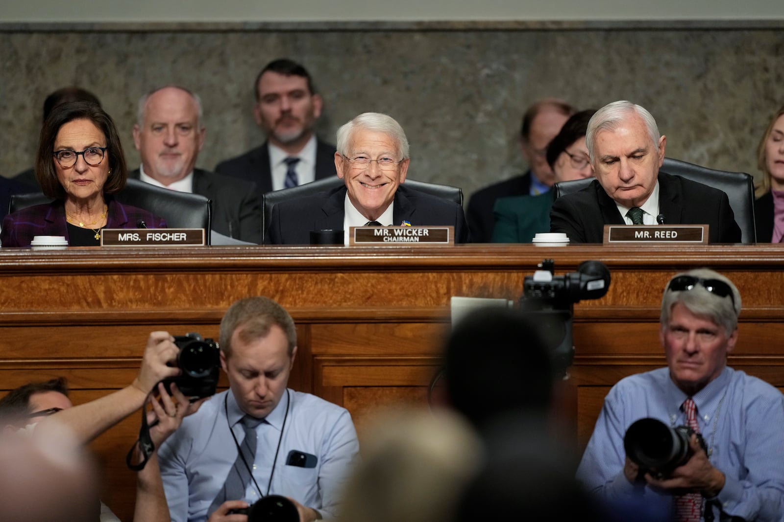 Sen. Deb Fischer, R-Neb., left, Committee chairman Sen. Roger Wicker, R-Miss., center, and Sen. Jack Reed, D-R.I., the ranking member, right, during the Senate Armed Services Committee confirmation hearing for Pete Hegseth, President-elect Donald Trump's choice to be Defense secretary, at the Capitol in Washington, Tuesday, Jan. 14, 2025. (AP Photo/Ben Curtis)