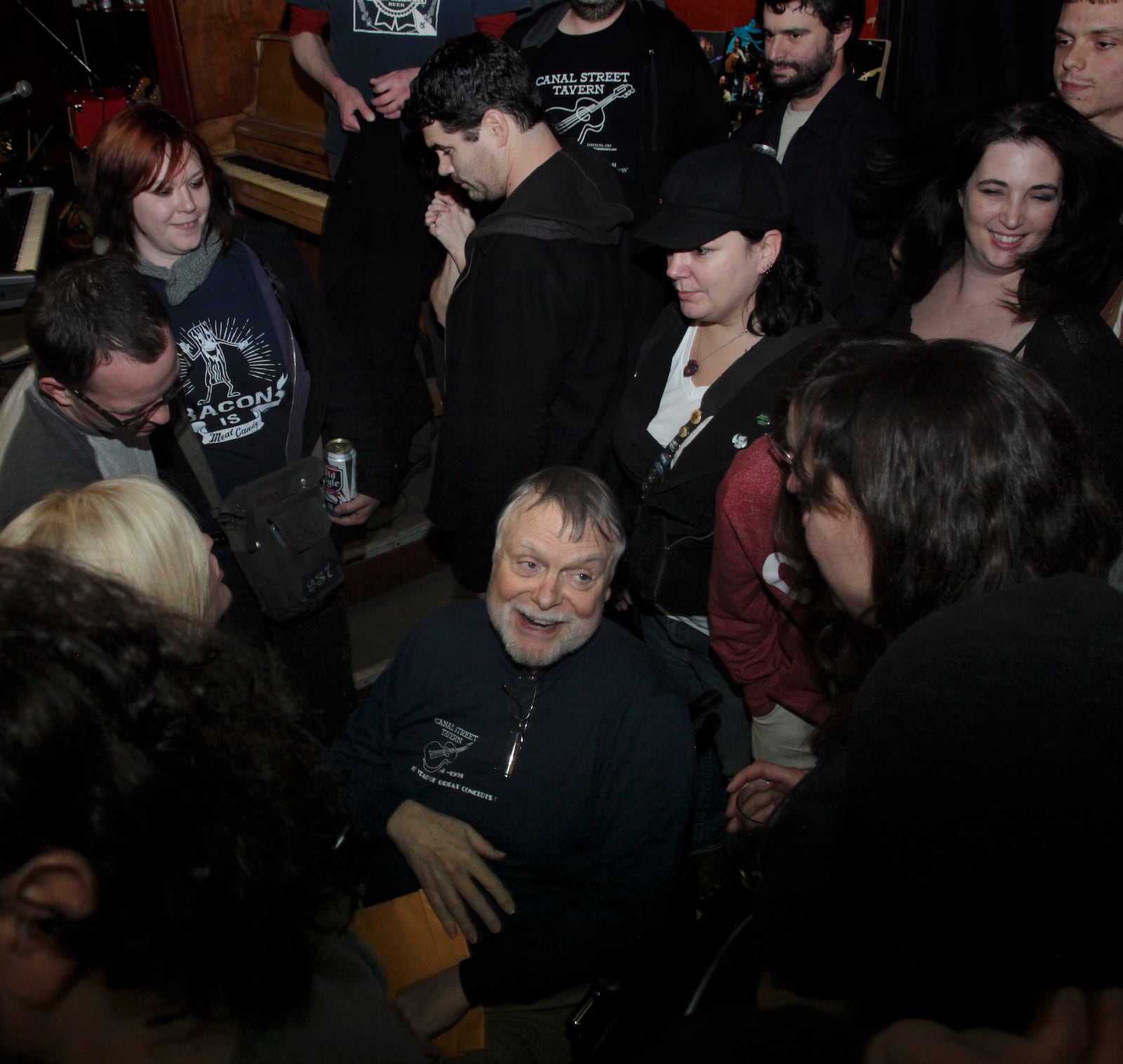 Mick Montgomery surrounding by former employees at the closing of Canal Street in 2013.