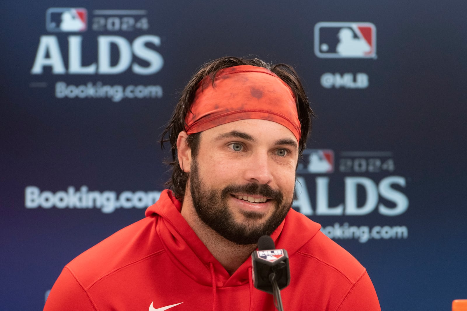 Cleveland Guardians' Austin Hedges speaks during a press conference before a baseball workout in Cleveland, Friday, Oct. 11, 2024, in preparation for Saturday's Game 5 of the American League Division Series against the Detroit Tigers.(AP Photo/Phil Long)