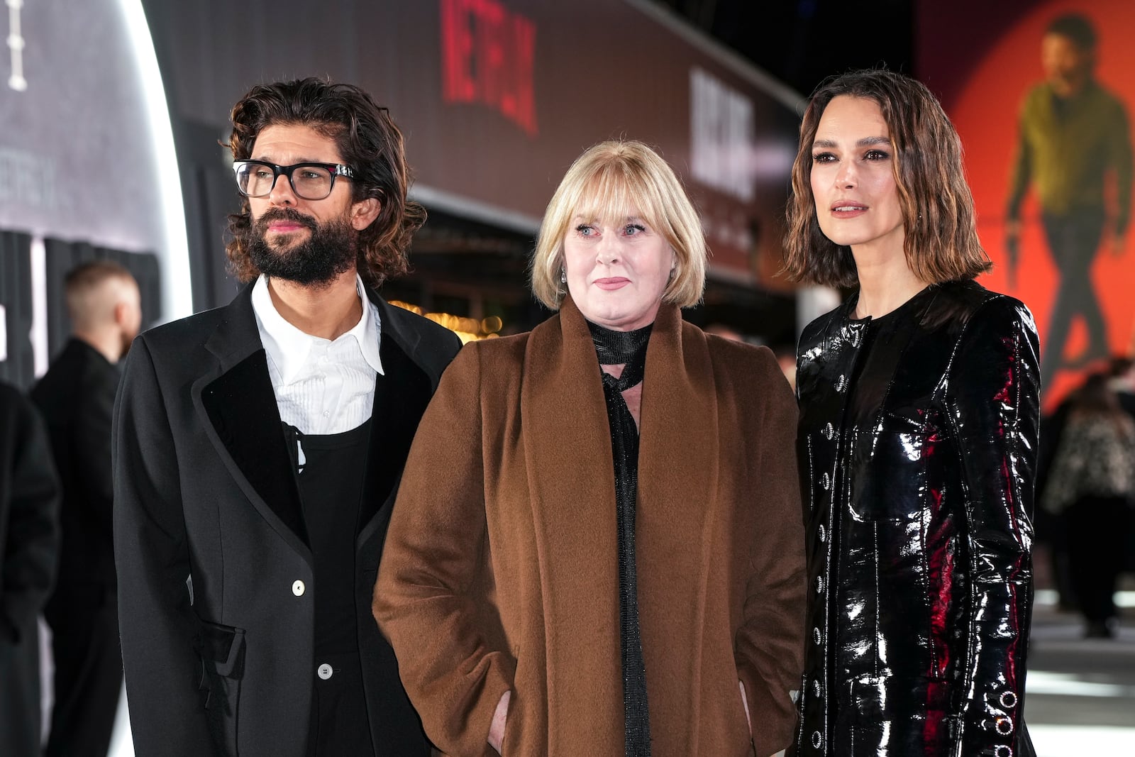 Ben Whishaw, from left, Sarah Lancashire and Keira Knightley pose for photographers upon arrival for the premiere of the television series 'Black Doves' on Tuesday, Dec. 3, 2024, in London. (Photo by Scott A Garfitt/Invision/AP)