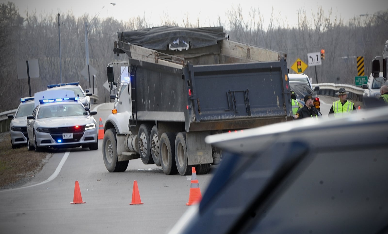 A teen girl was killed and two more teens were injured in a crash involving a car and dump truck at the intersection of Treibein and Dayton-Xenia roads in Beavercreek Twp. MARSHALL GORBY / STAFF