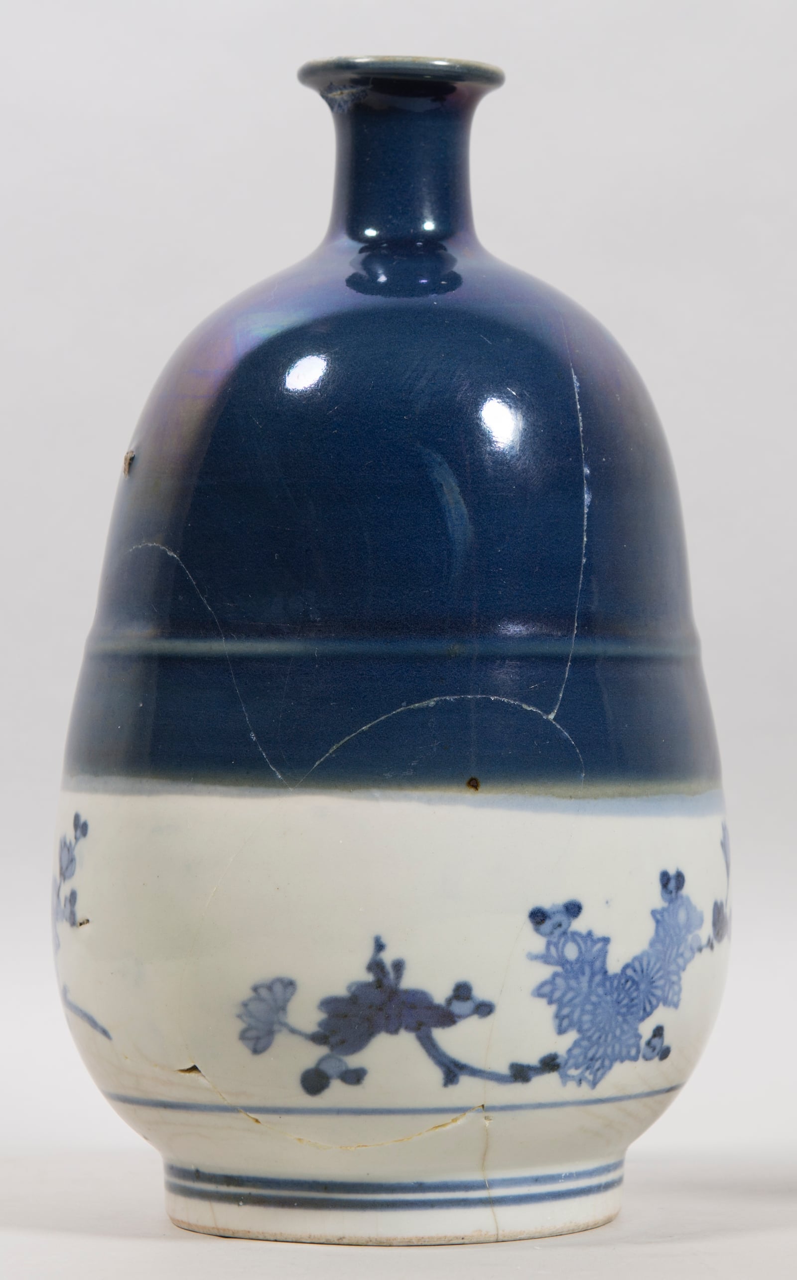 "Bottle with Chrysanthemum Design'' is one of 50 pieces of work on display in the Dayton Art Institute's "Art for the Ages: Conservation at DAI'' exhibit. Conservation work on this piece included removing prior repair work and applying new techniques to repair cracks in the object. CONTRIBUTED