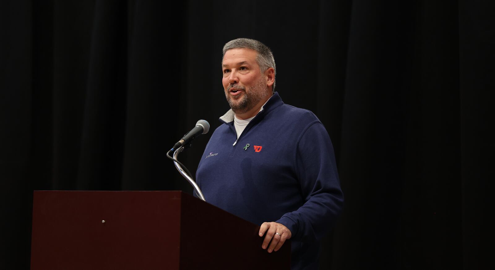 Scott Markovich, of CareSource, speaks at "The Spotlight, To Shine A Light On Mental Health" at UD Arena on Thursday, Oct. 19, 2023. David Jablonski/Staff