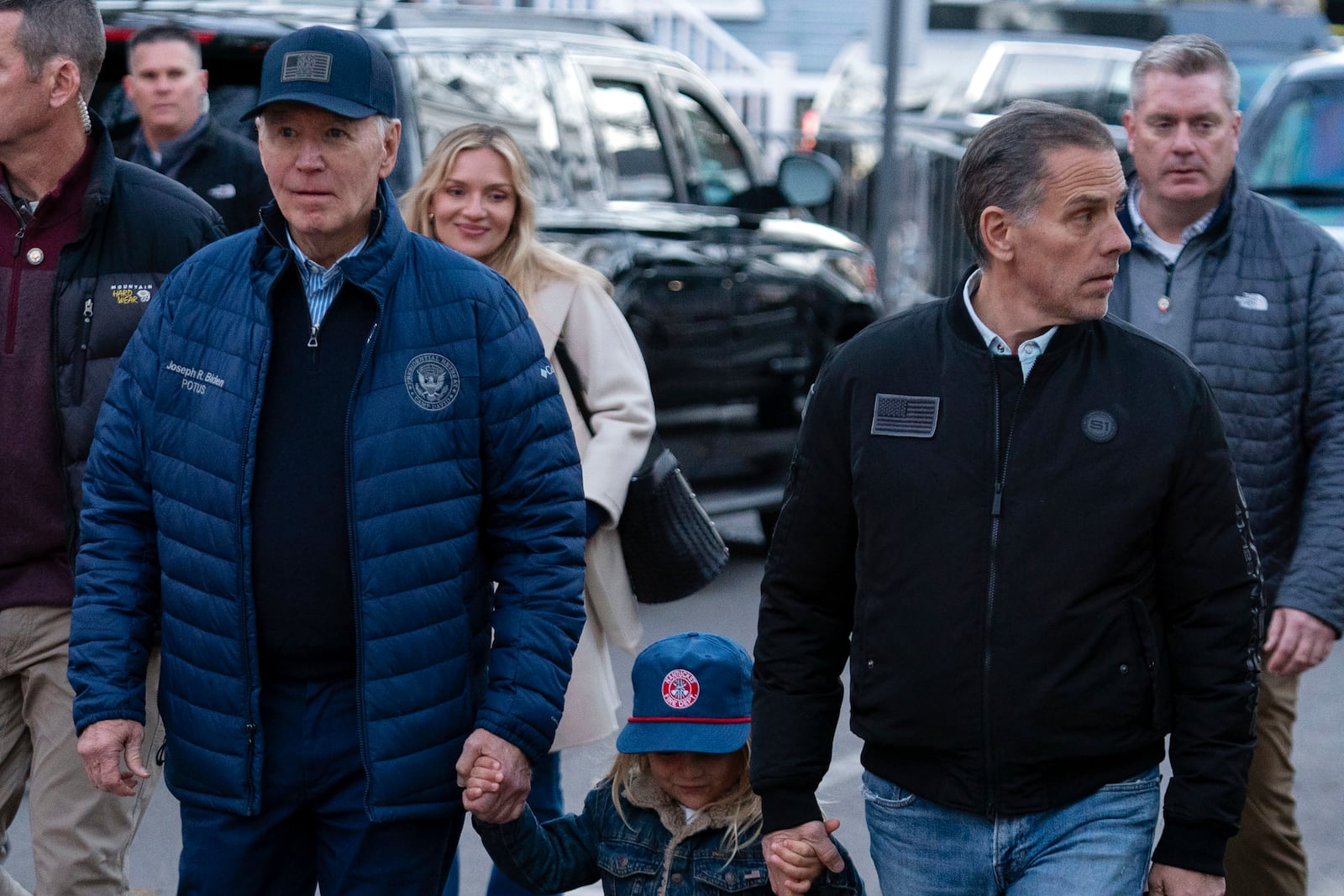 President Joe Biden with his son Hunter Biden and his grandson Beau walk in downtown Nantucket Mass., Friday, Nov. 29, 2024. (AP Photo/Jose Luis Magana)