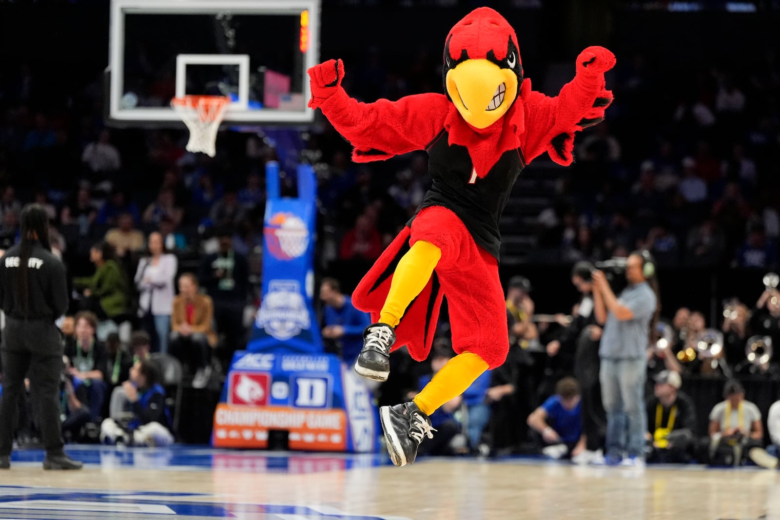 The Louisville mascot performs during an NCAA college basketball game against Duke in the championship of the Atlantic Coast Conference tournament, Saturday, March 15, 2025, in Charlotte, N.C. (AP Photo/Chris Carlson)