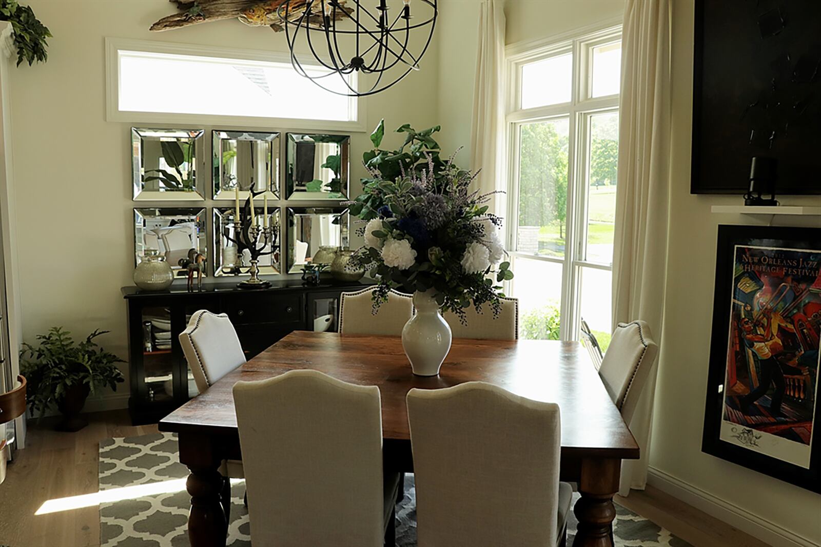 A transom window allows for natural light and furniture wall space within the dining room. CONTRIBUTED PHOTO BY KATHY TYLER