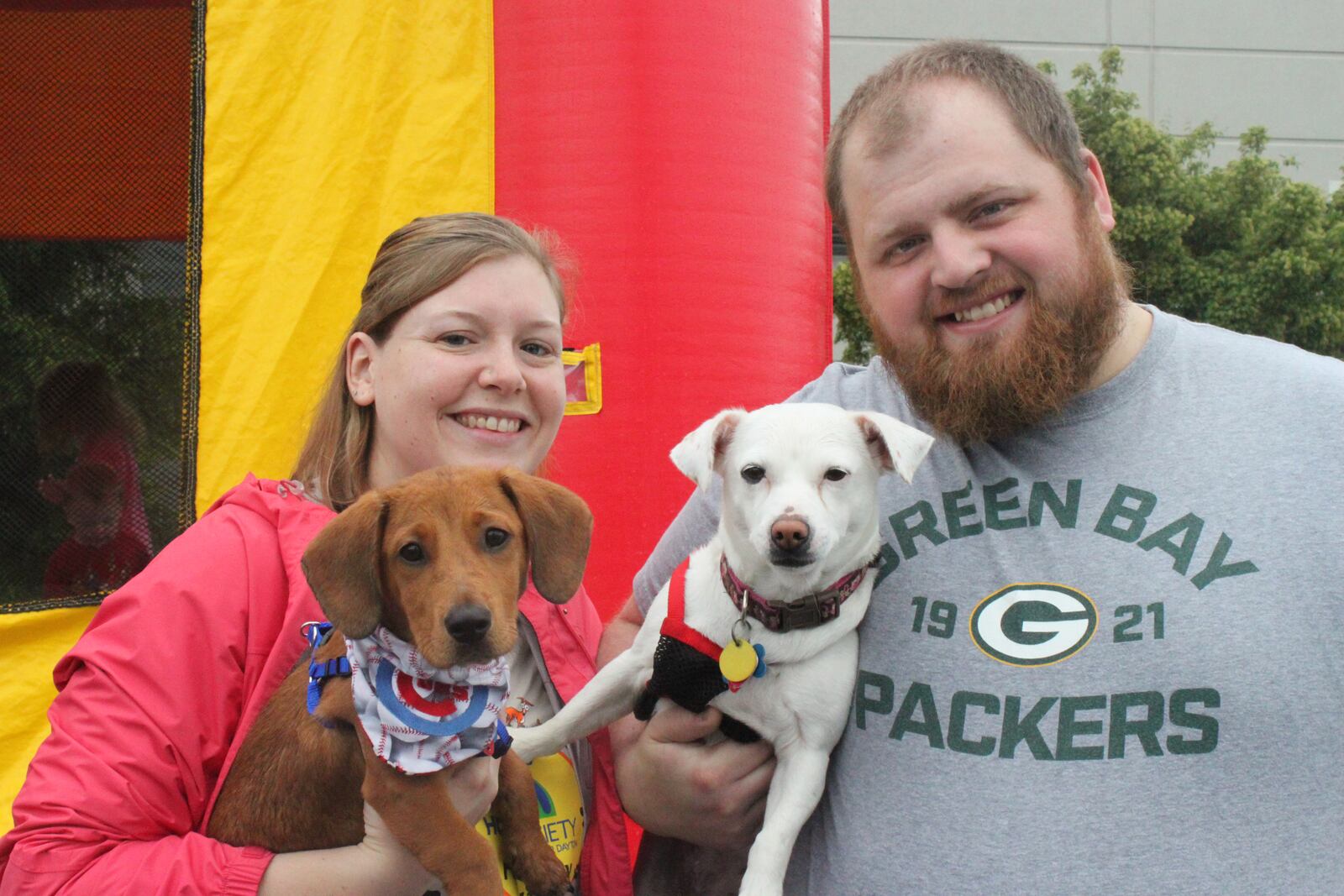 Jessica and Jeff Singleton attend Furry Skurry with their two dogs Wrigley (left) and Daisy (right). Both dogs were adopted from the Humane Society of Greater Dayton. Photo by Jessica Garringer