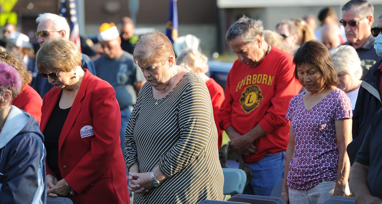 People bow their heads duing the invocation for the 20th annual 9/11 Memorial Ceremony in Fairborn Saturday, Sept. 11, 2021 on the front lawn of Calamityville, the National Center for Medical Readiness. MARSHALL GORBY/STAFF























