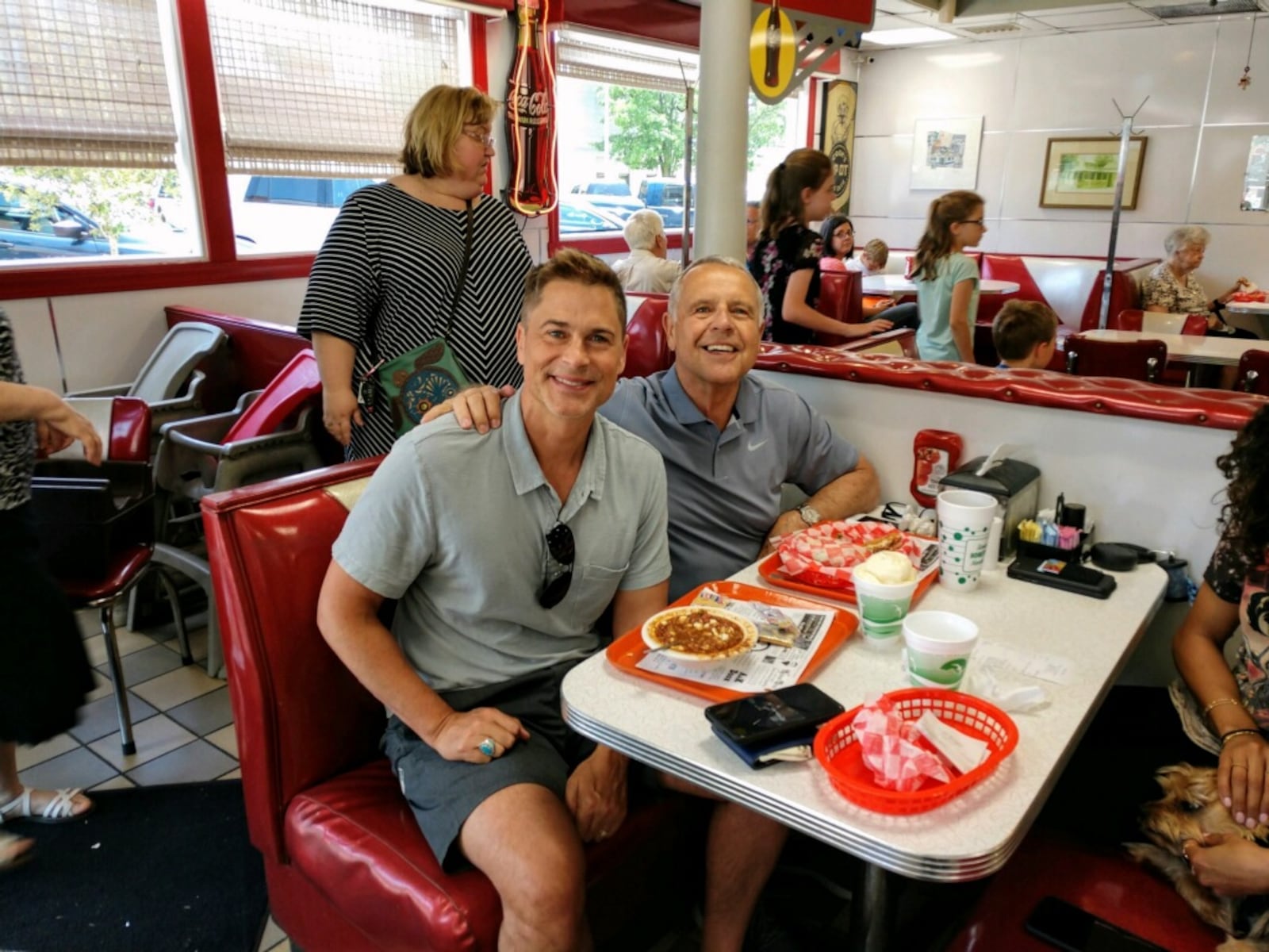 Rob Lowe and his dad eat a lunch of burgers and pie at The Spot in Sidney during a visit in 2019.