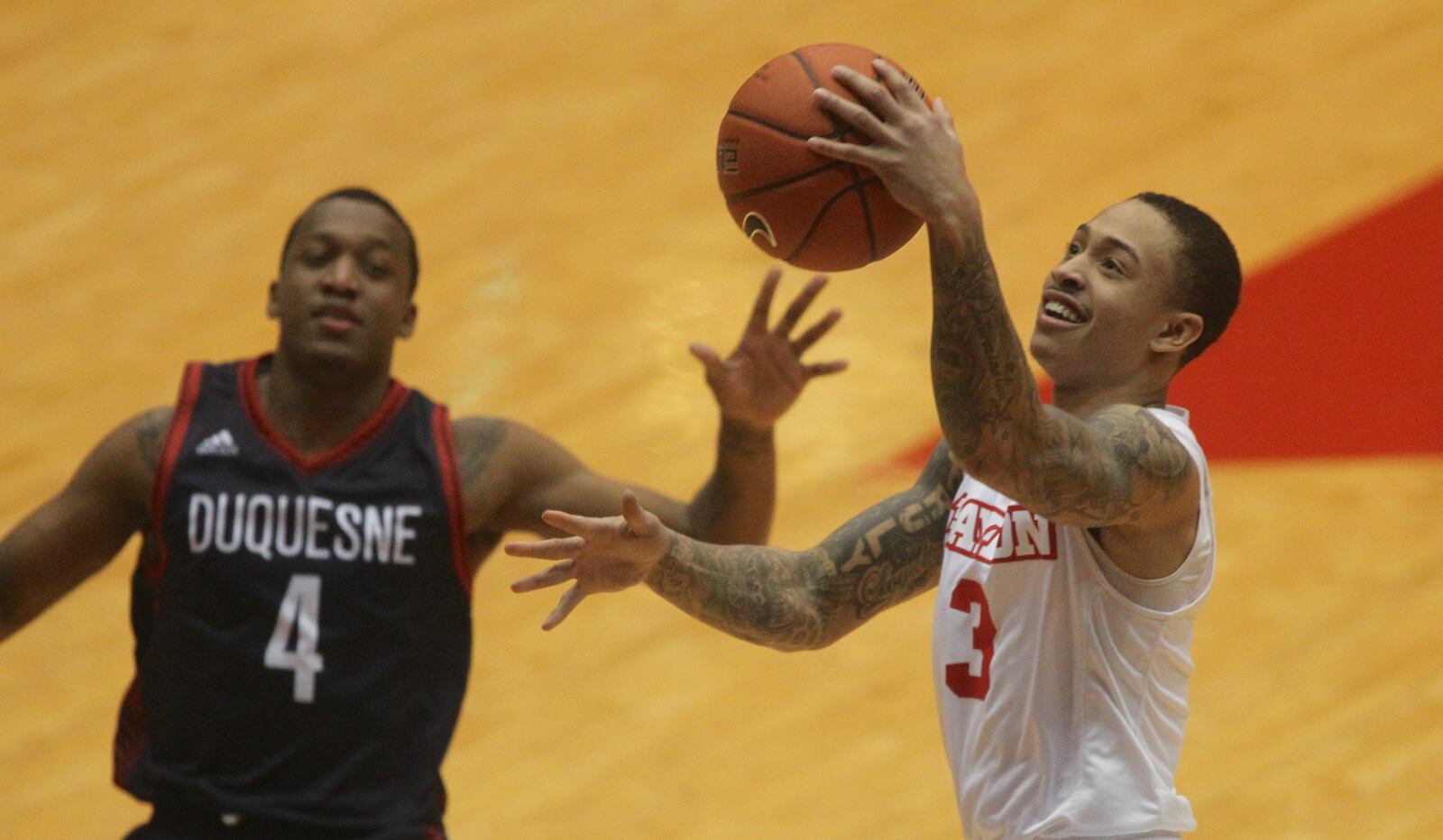 Dayton’s Kyle Davis scores against Duquesne on Saturday, Feb. 4, 2017, at UD Arena. David Jablonski/Staff