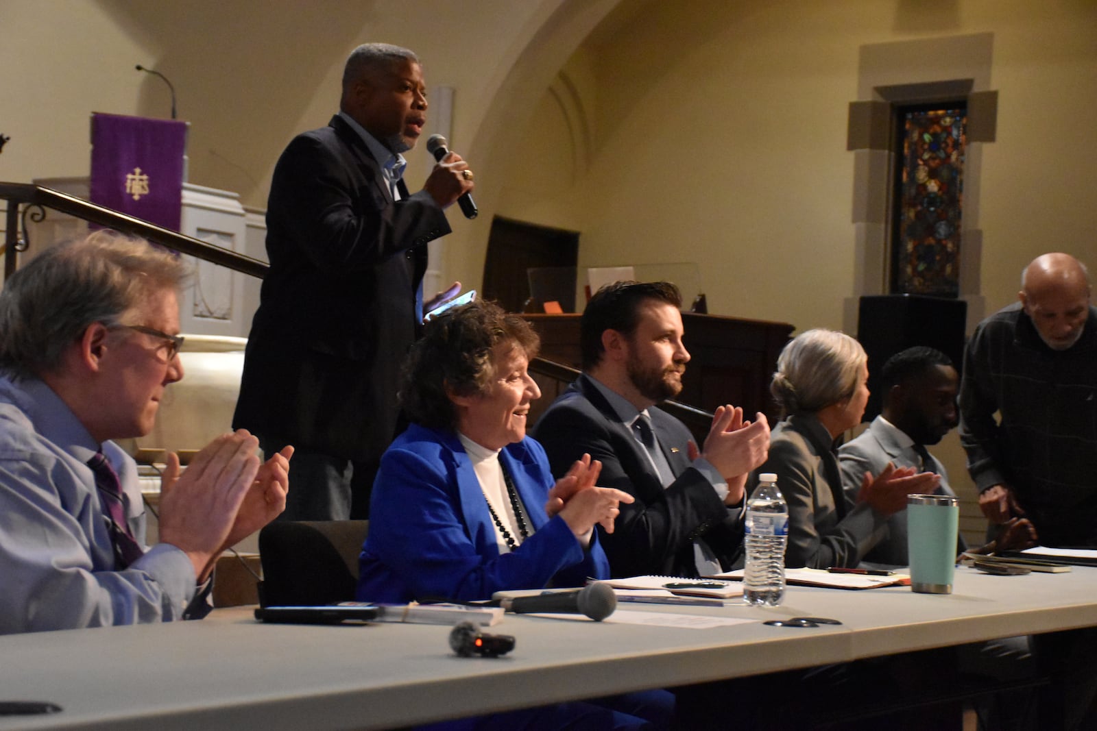 Dayton Unit NAACP President Derrick Foward talks at the town hall candidate forum on Monday, March 24, 2025. Commission candidates (from left to right) are Darryl Fairchild, Valerie Duncan, C. Jacob Davis, Karen Wick and Darius Beckham. CORNELIUS FROLIK / STAFF