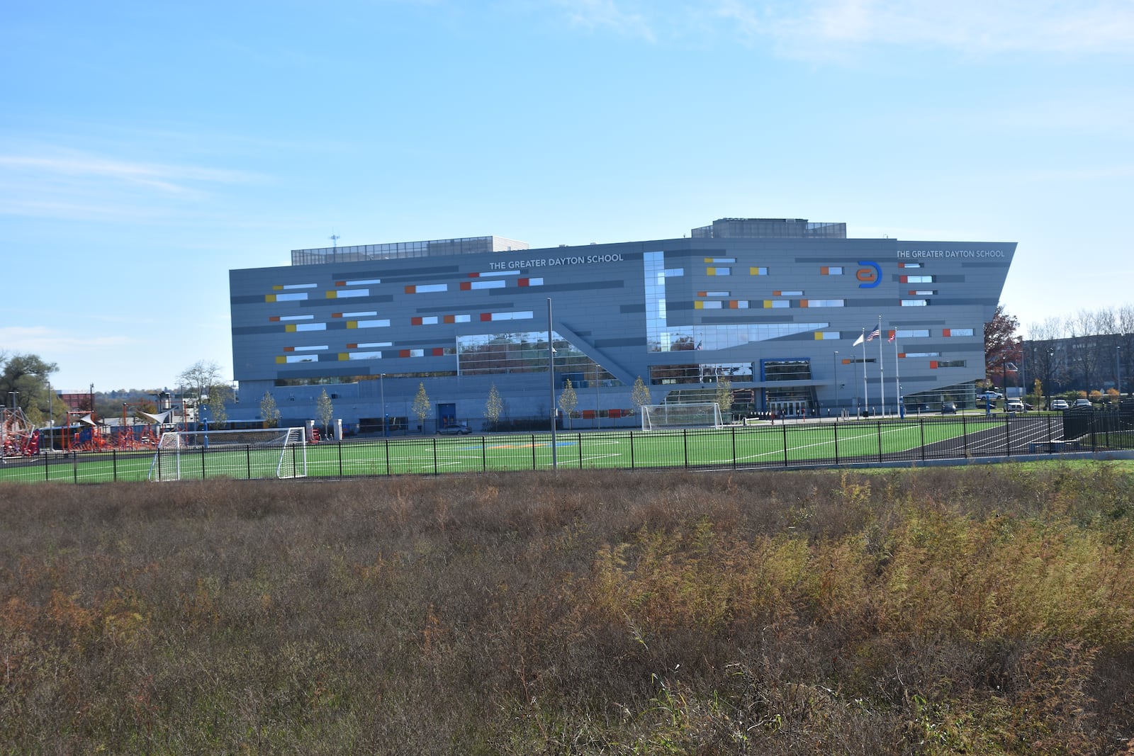 An empty field just north of the Greater Dayton School will be transformed into a new public park called Colonel Deeds Park. The school is across the river from RiverScape and the Water Street apartments in downtown Dayton. CORNELIUS FROLIK / STAFF