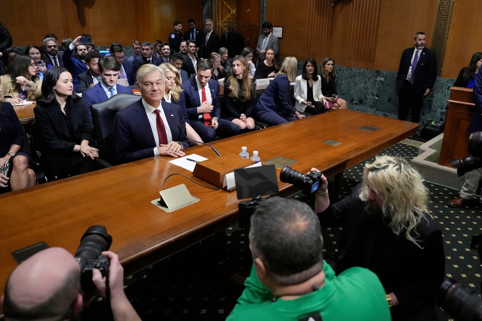 Dr. Mehmet Oz, President Donald Trump's pick to lead the Centers for Medicare and Medicaid Services, sits before testifying at his confirmation hearing before the Senate Finance Committee, on Capitol Hill in Washington, Friday, March 14, 2025. (AP Photo/Ben Curtis)