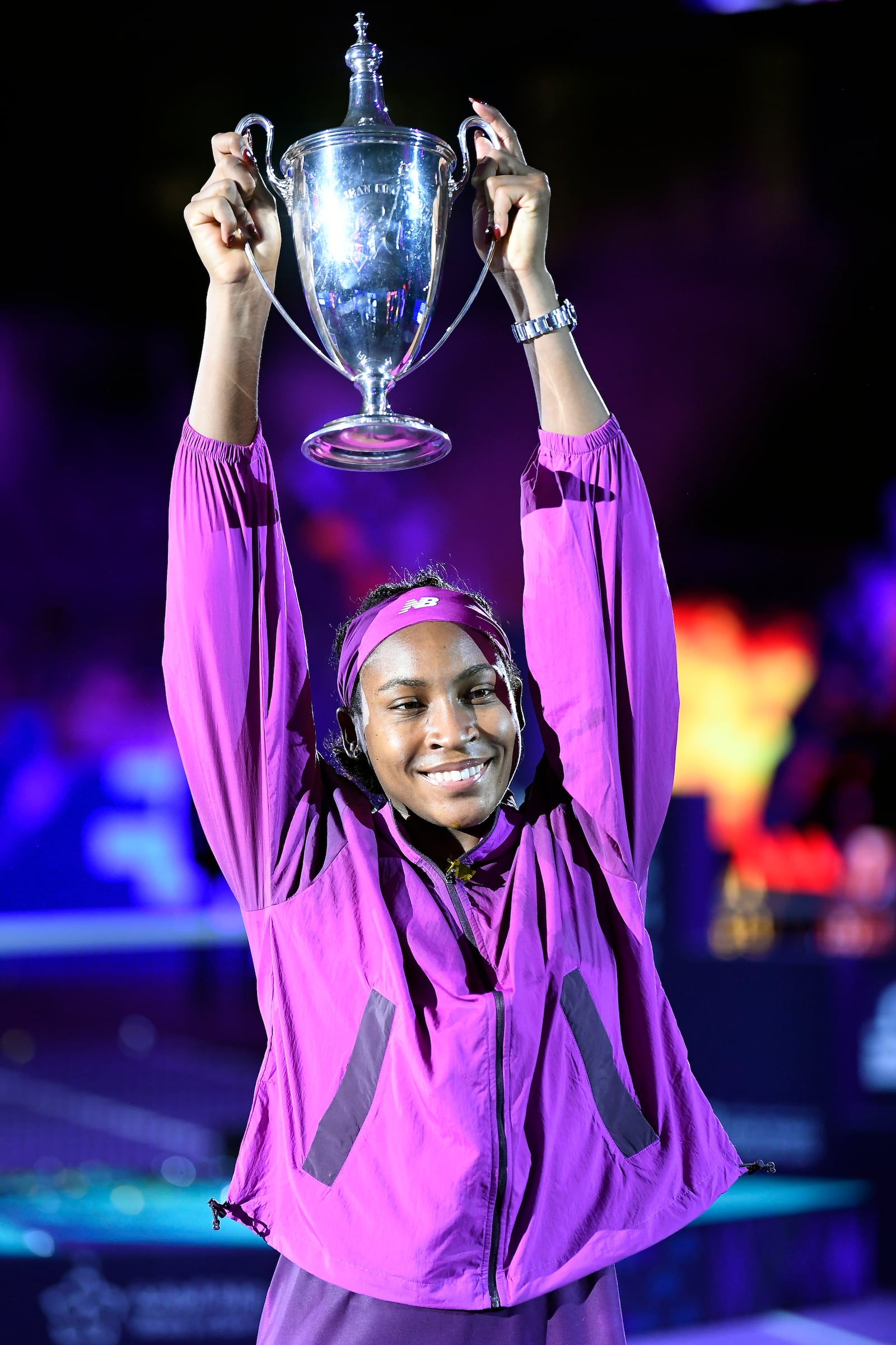 Coco Gauff of the U.S. holds her trophy after winning against China's Qinwen Zheng in their women's singles final match of the WTA finals at the King Saud University Indoor Arena, in Riyadh, Saudi Arabia, Saturday, Nov. 9, 2024. (AP Photo)