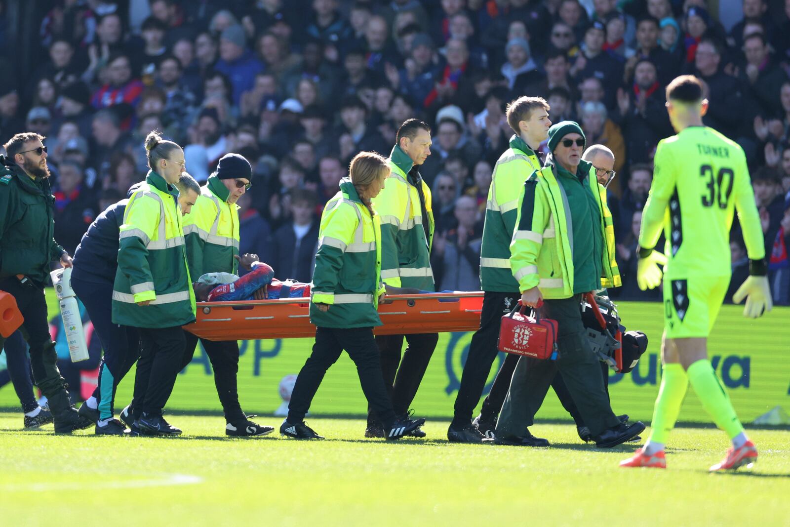 Crystal Palace's Jean-Philippe Mateta is substituted off on a stretcher during the English FA Cup soccer match between Crystal Palace and Millwall at Selhurst Park, London, England, Saturday, March 1, 2025. (AP Photo/Ian Walton)