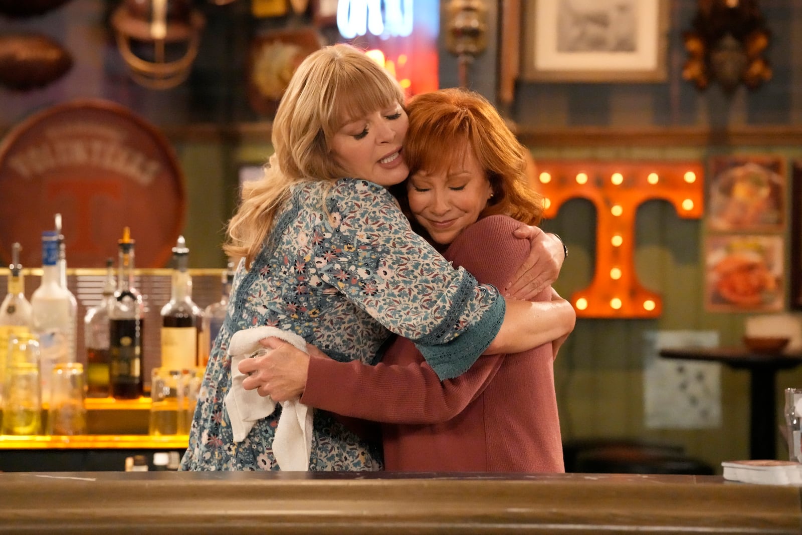 This image released by NBC shows Melissa Peterman, left, and Reba McEntire in a scene from "Happy Place." (Casey Durkin/NBC via AP)