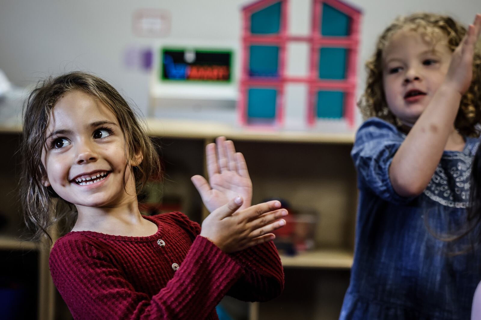 Piqua Christian prekindergarten students from left, Kora Eskel and Jolene Davis, sing the sticky sticky waffle song at the school Friday, July 7, 2023. Jim Noelker/Staff