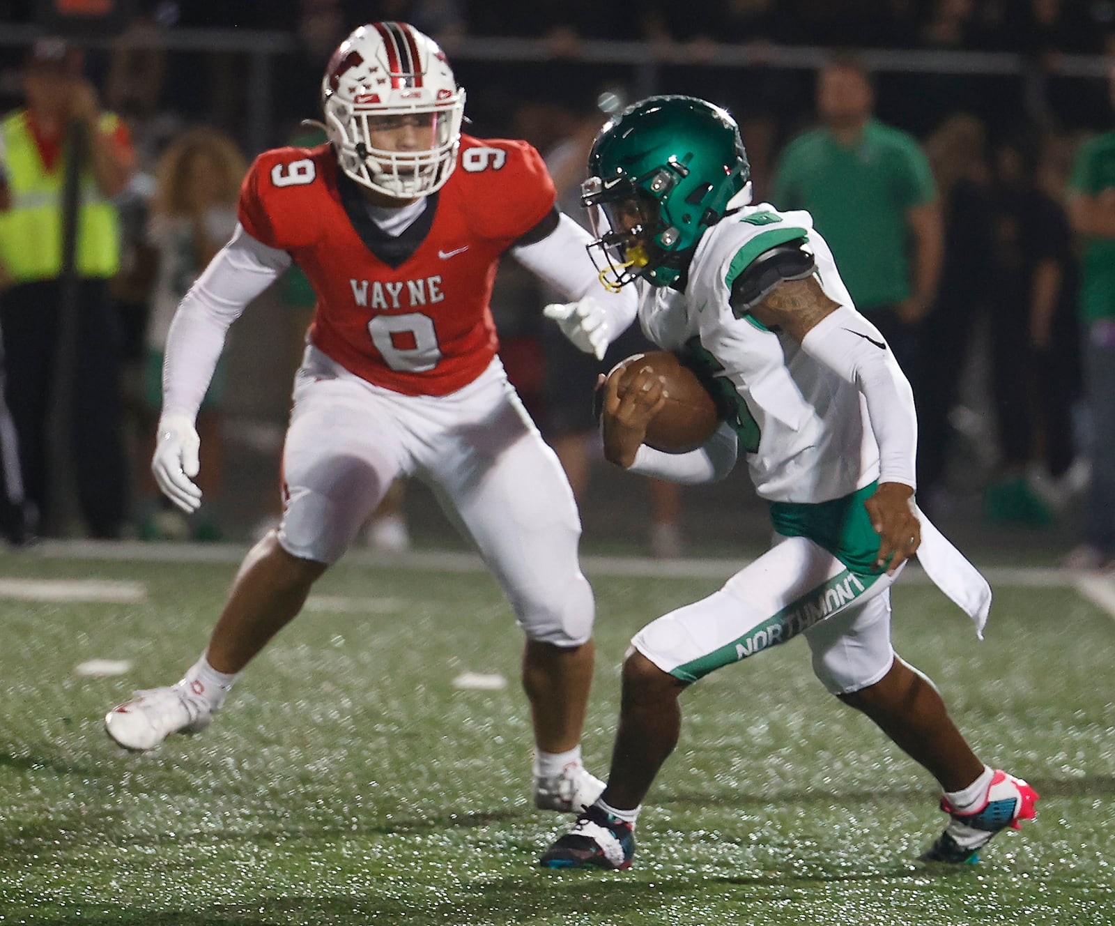 Northmont's Deuce Cortner tries to avoid Wayne's Javon Hammonds. BILL LACKEY/STAFF