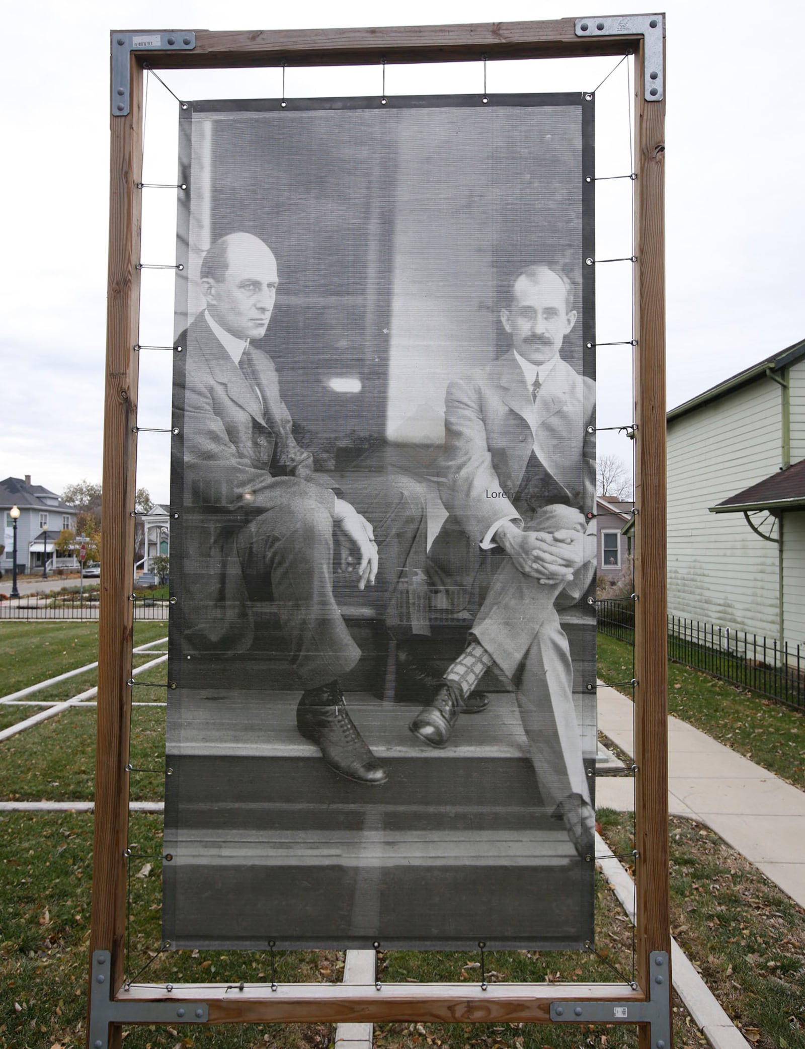 Seven Hawthorn Street in Dayton was the location of the Wright Family home at the turn of the century.  Photographer, author and aviation historian Dan Patterson has installed a large art photo print of the Wright Brothers on the site.  Henry Ford moved this house and the Wright's bicycle shop to Michigan in the 1930s.  TY GREENLEES / STAFF