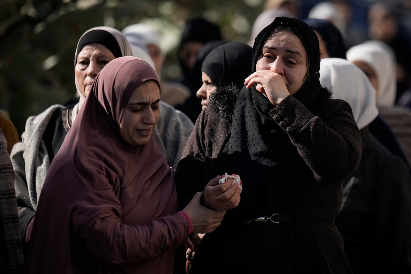 Mourners attend the funeral of Mohammed Abu Kishk, who was killed in clashes with Israeli forces during his funeral at the Askar refugee camp in the Israeli-occupied West Bank, Tuesday Dec. 17, 2024 (AP Photo/Majdi Mohammed).