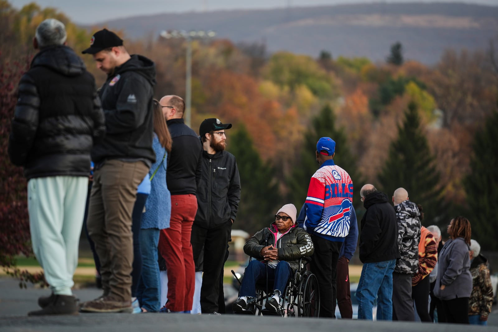 Liza Fortt, 74, center, waits in line to cast her ballot for Democratic presidential nominee Vice President Kamala Harris at her polling place at Scranton High School in Scranton, Pa., on Election Day, Tuesday, Nov. 5, 2024. (AP Photo/Matt Rourke)