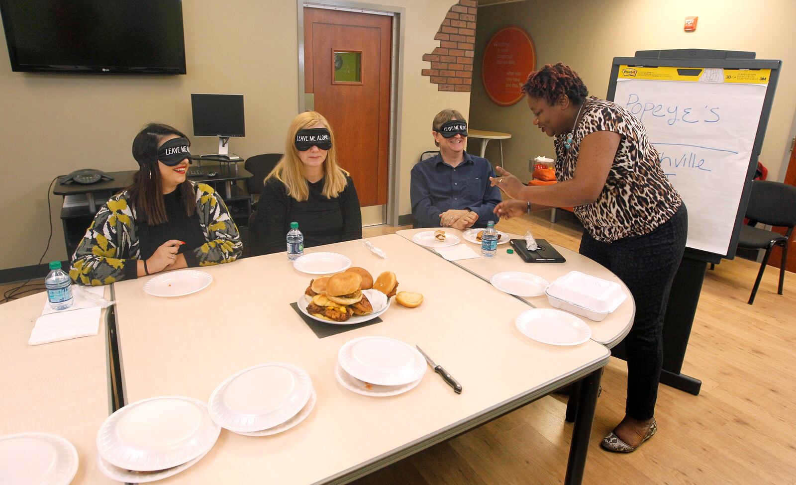 The staff of Dayton.com took part in a chicken sandwich taste test. From left to right are Allegra Czerwinski, Michelle Fong, Mark Fisher and Amelia Robinson. LISA POWELL / STAFF