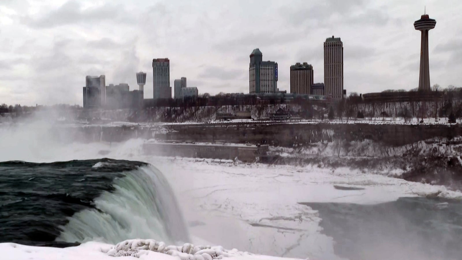 Buildings in Ontario are viewed from Niagara Falls Wednesday, Feb. 12, 2025, in Niagara Falls, N.Y. (AP Photo/Mike Householder)