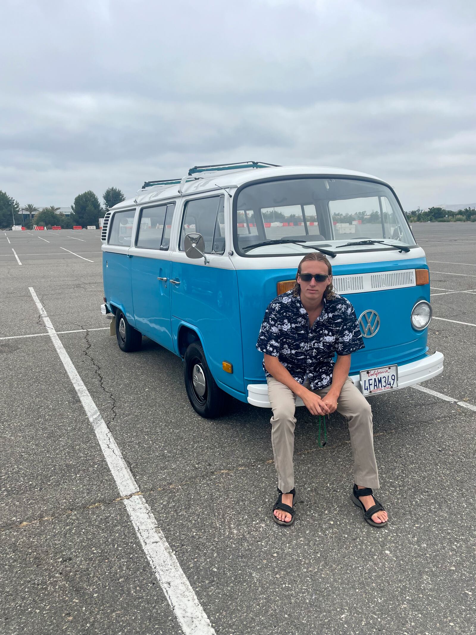 Preston Martin poses for a photo in front of his VW van on Aug. 21, 2022 in Irvine, Calif. (Cebrina Martin via AP)