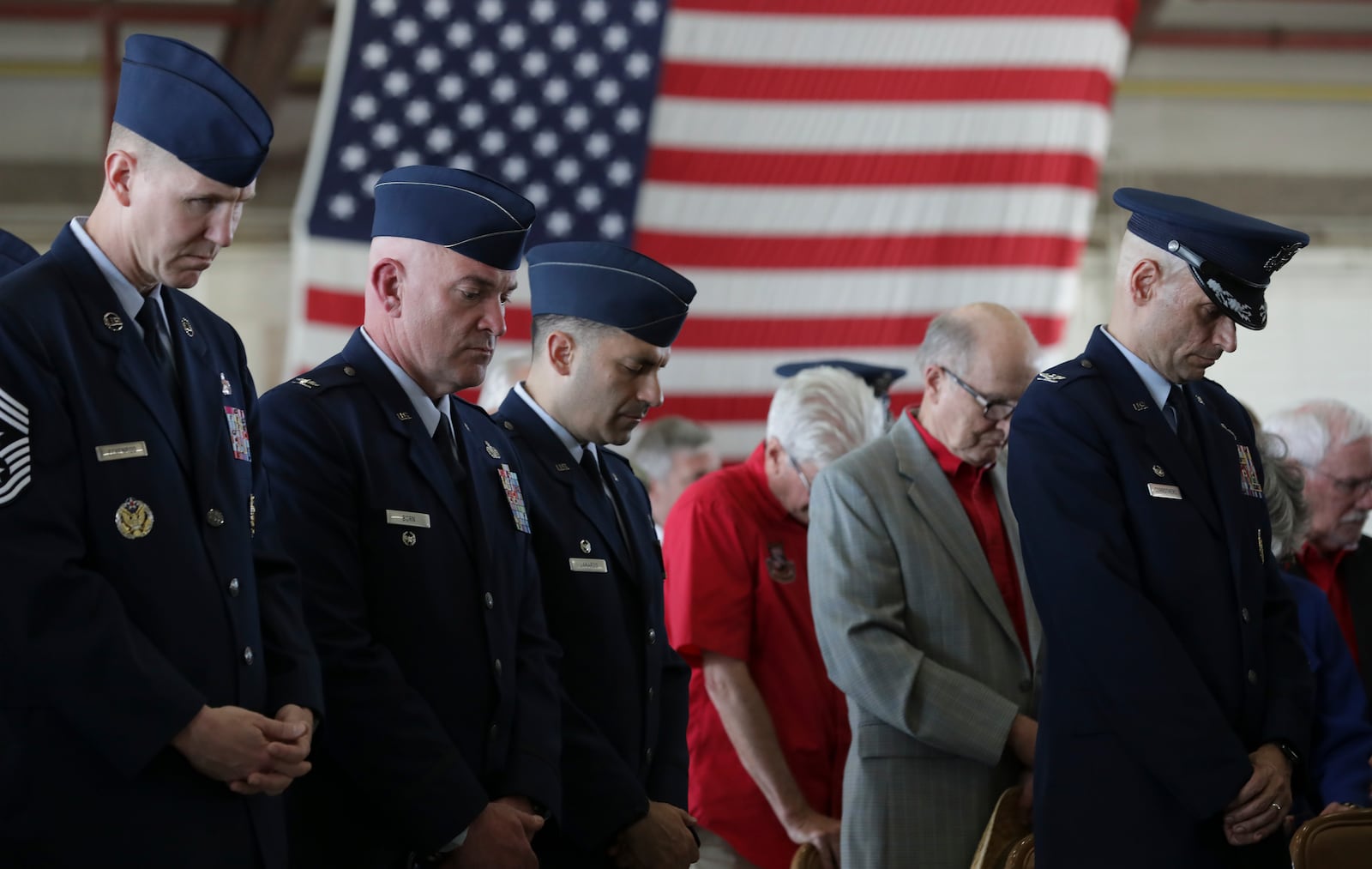 Air Force personnel show respect during a prayer at the memorial service for Lt. Col. Richard "Dick" E. Cole at Joint Base San Antonio-Randolph, on Thursday,  April 18, 2019.