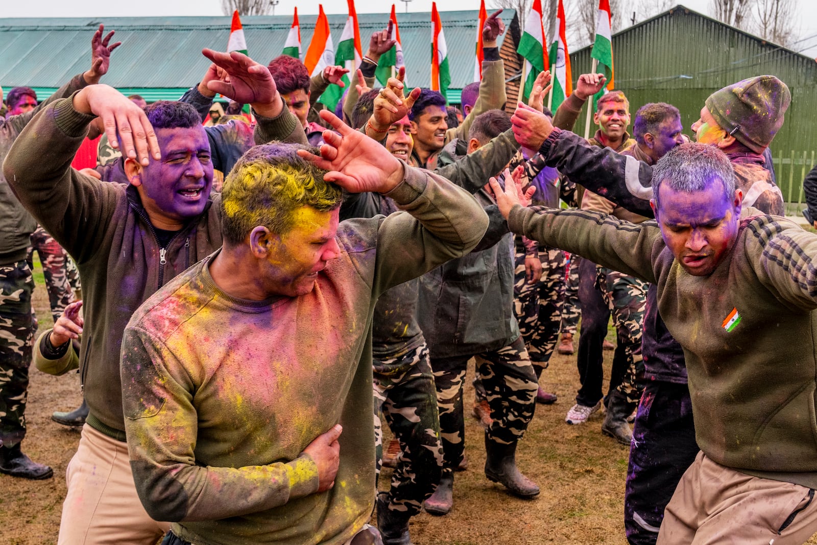 Indian security personnel from Sasastra Seema Bal (SSB) dance as they celebrate Holi inside their base camp in Srinagar, Indian controlled Kashmir, Friday, March 14, 2025. (AP Photo/Dar Yasin)