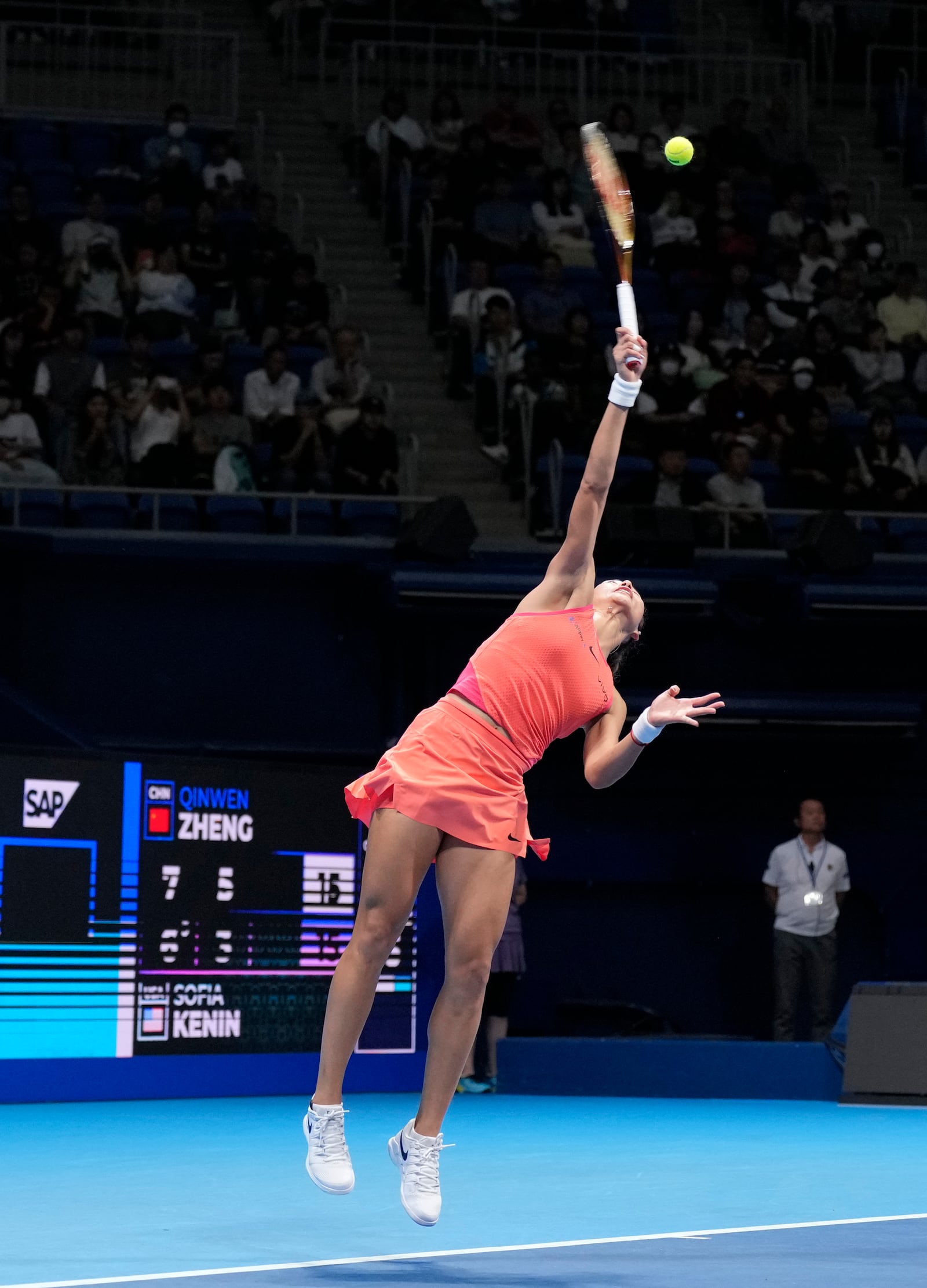 China's Zheng Qinwen plays against Sofia Kenin of the United States during the final match of the Pan Pacific Open women's tennis tournament at Ariake Coliseum, in Tokyo, Sunday, Oct. 27, 2024. (AP Photo/Eugene Hoshiko)