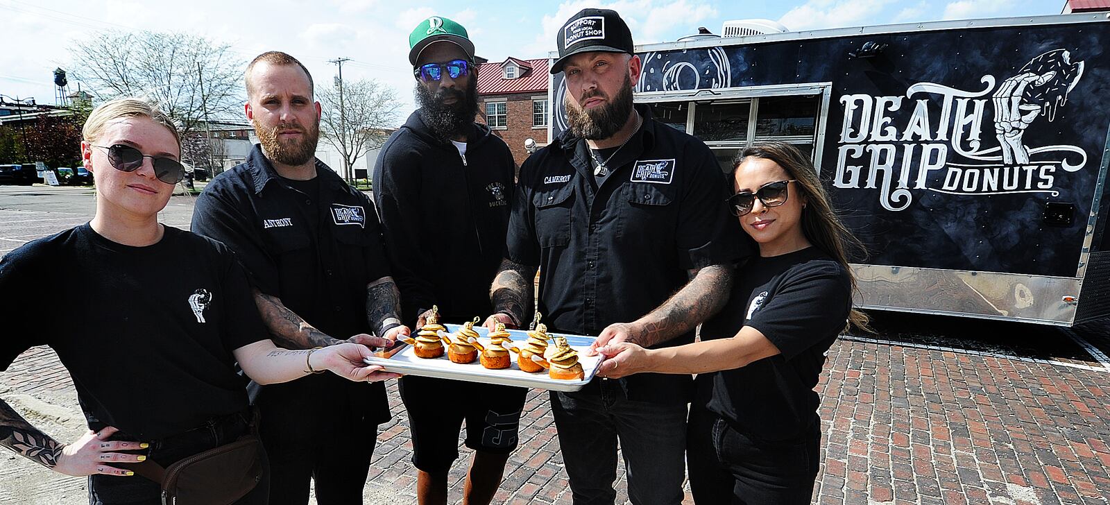 Death Grip Donuts is collaborating with Uncle Boof’s World Famous Pancake Mix for a “Locals Only” donut featuring a traditional vanilla donut with maple glaze, three mini pancakes and a dollop of cinnamon butter that’s served with a pipette of maple syrup. Pictured left to right is Kylie Bauer, Anthony Brewer, Dexter Clay, Cameron Hill and Lainey Lucas. MARSHALL GORBY\STAFF