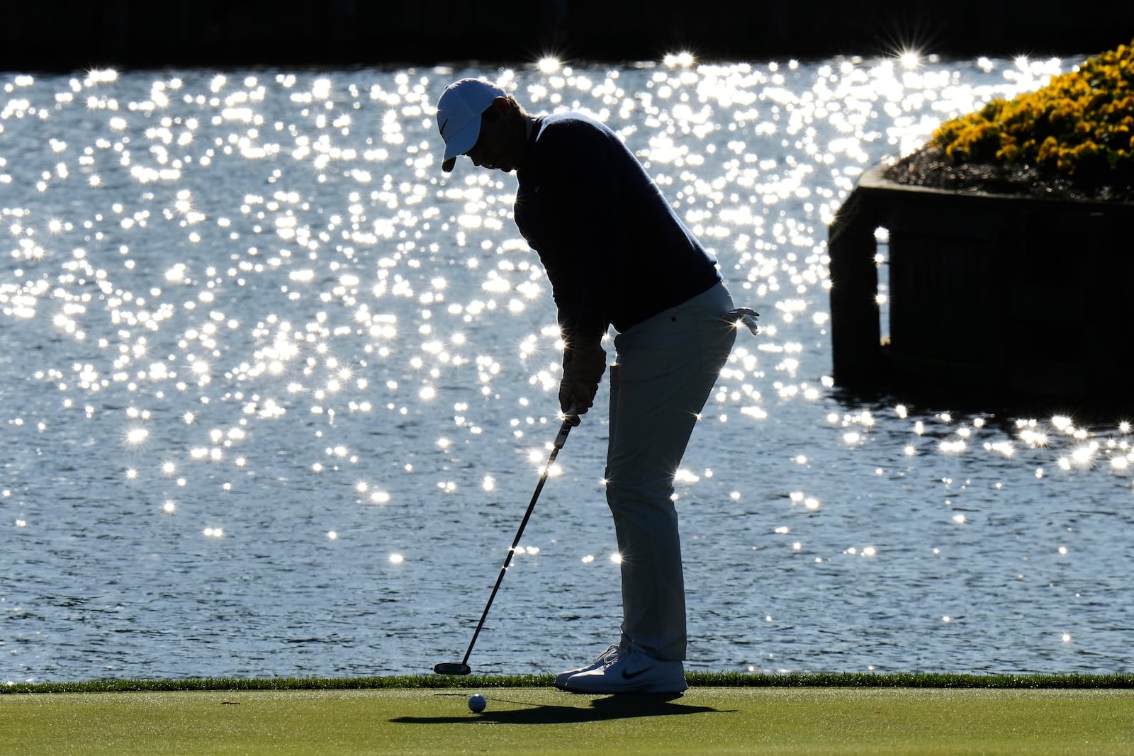 Rory McIlroy, of Northern Ireland, putts on the 17th green during a playoff round of The Players Championship golf tournament Monday, March 17, 2025, in Ponte Vedra Beach, Fla. (AP Photo/Chris O'Meara)