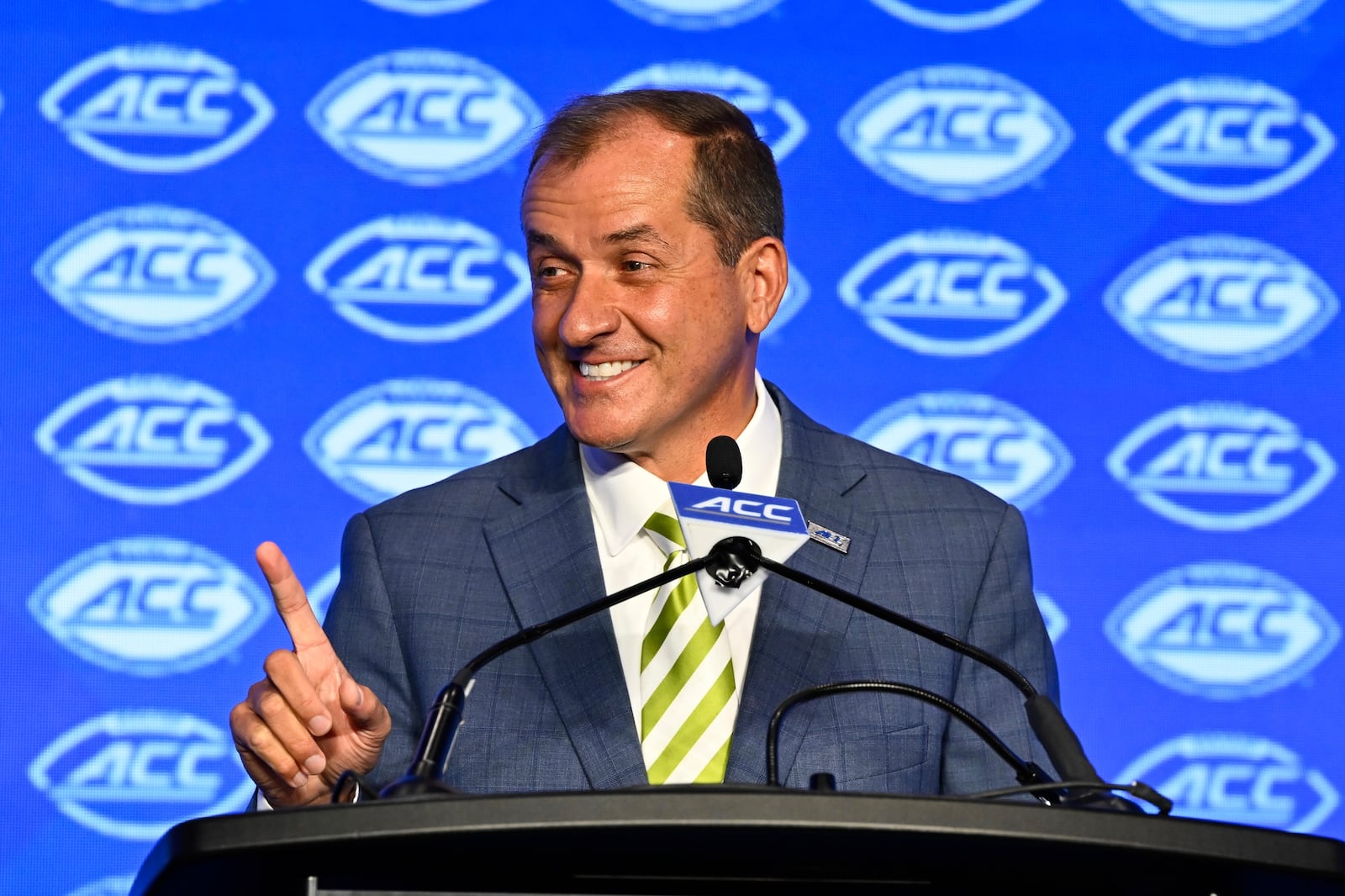 FILE - Atlantic Coast Conference commissioner Jim Phillips smiles during an NCAA college football news conference at the ACC media days, Monday, July 22, 2024, in Charlotte, N.C. (AP Photo/Matt Kelley, File)