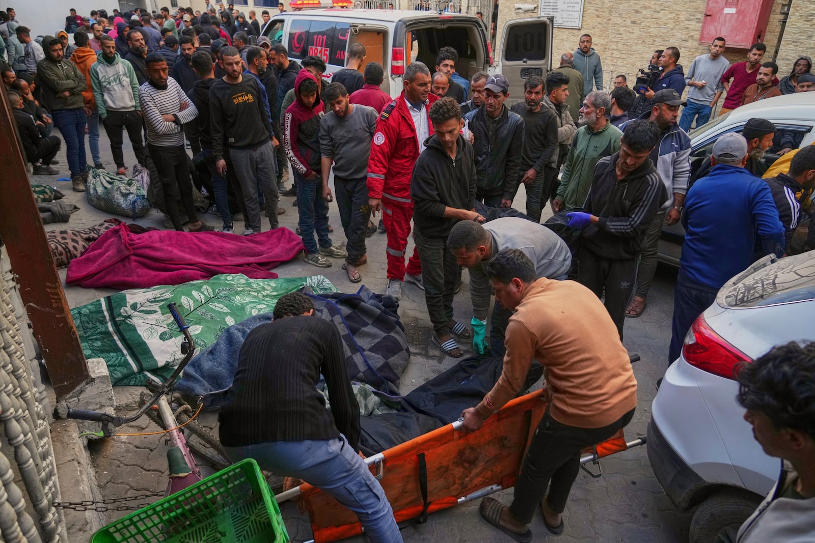 Bodies of people killed during overnight Israeli army airstrikes across the Gaza Strip are left in the yard of the the Al-Ahli hospital in Gaza City, Tuesday, March 18, 2025. (AP Photo/Jehad Alshrafi)