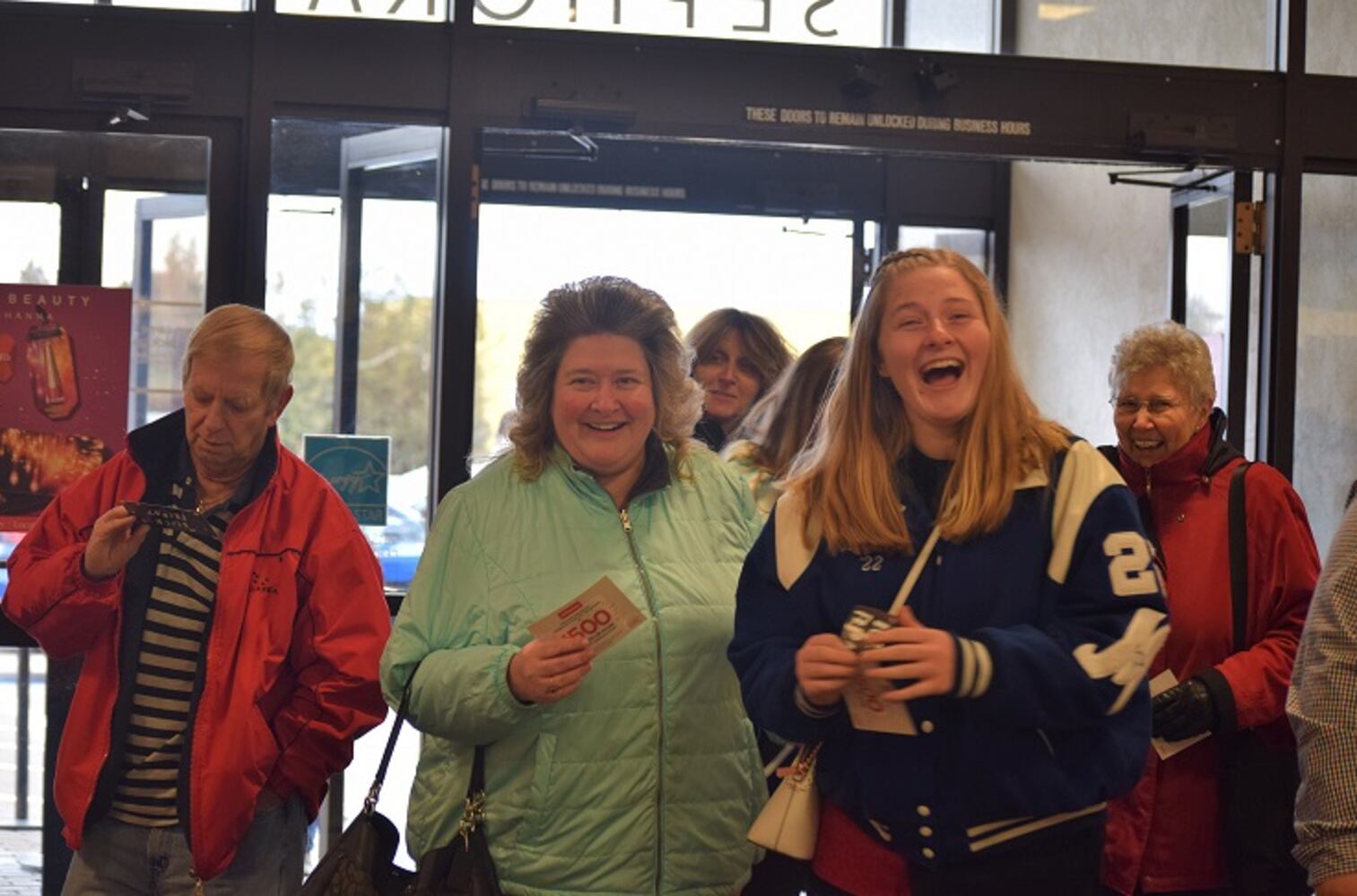 PHOTOS: Hundreds like up outside JCPenney for doorbusters, coupons