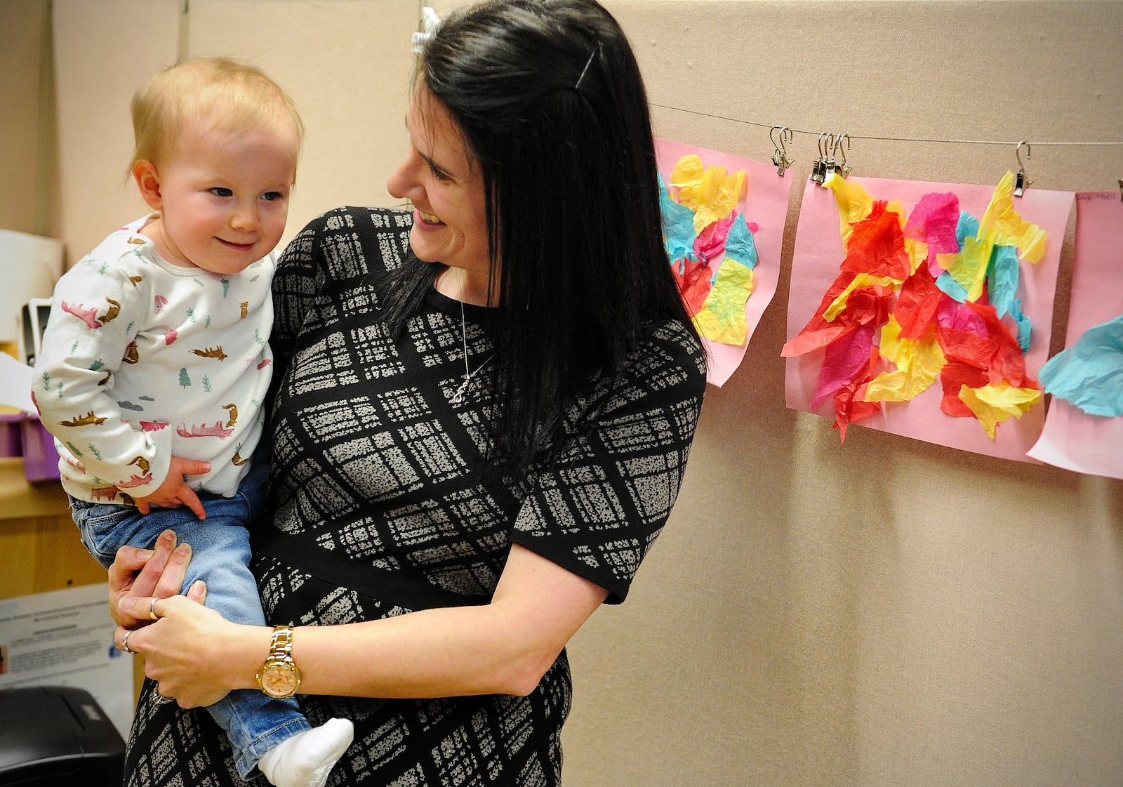 Nicole Myrick, director of the Mini University talks to one of the children at the daycare center Wednesday March 9, 2022.  MARSHALL GORBY\STAFF