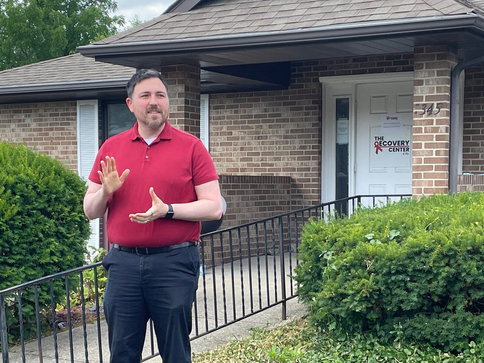 Jesse Dennison, the new clinical director for the Recovery Center of Dayton, speaks at a recent open house held at its offices in Centerville about the center's services. SAM WILDOW\STAFF