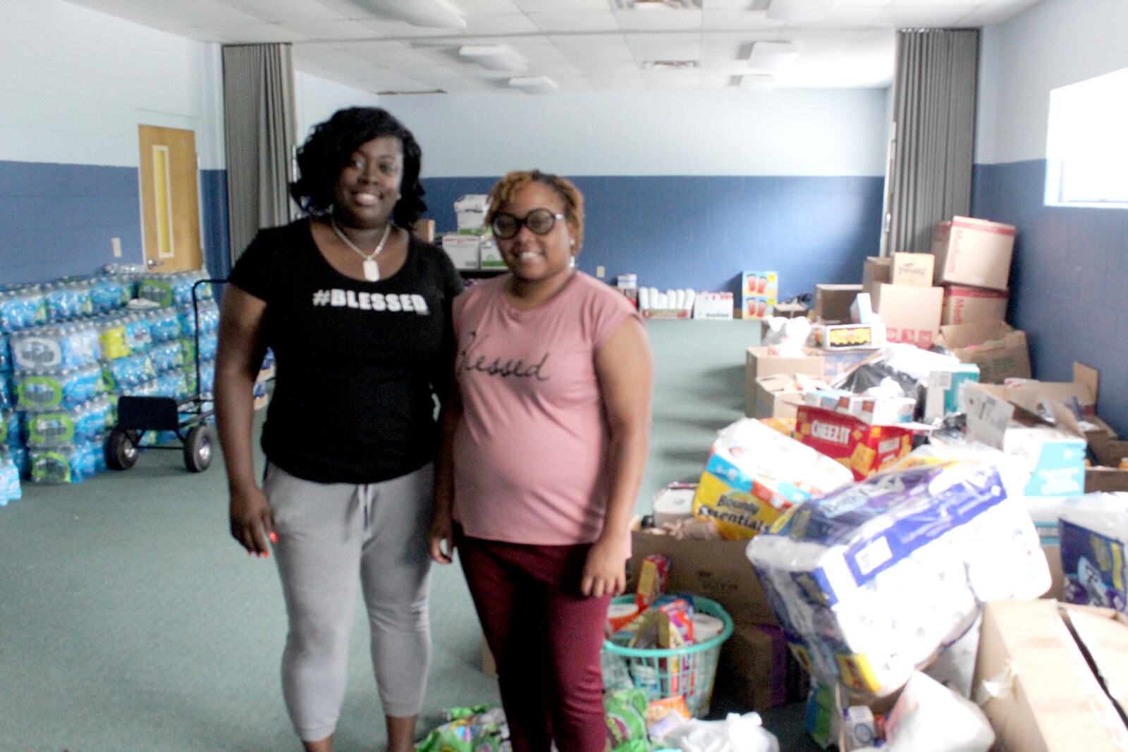 Shateveia Allen of GG's Kiddie Kare  and SoLoved founder Ashley N. Browning.  Allen is allowing Browning to use part of her property as tornado relief hub.