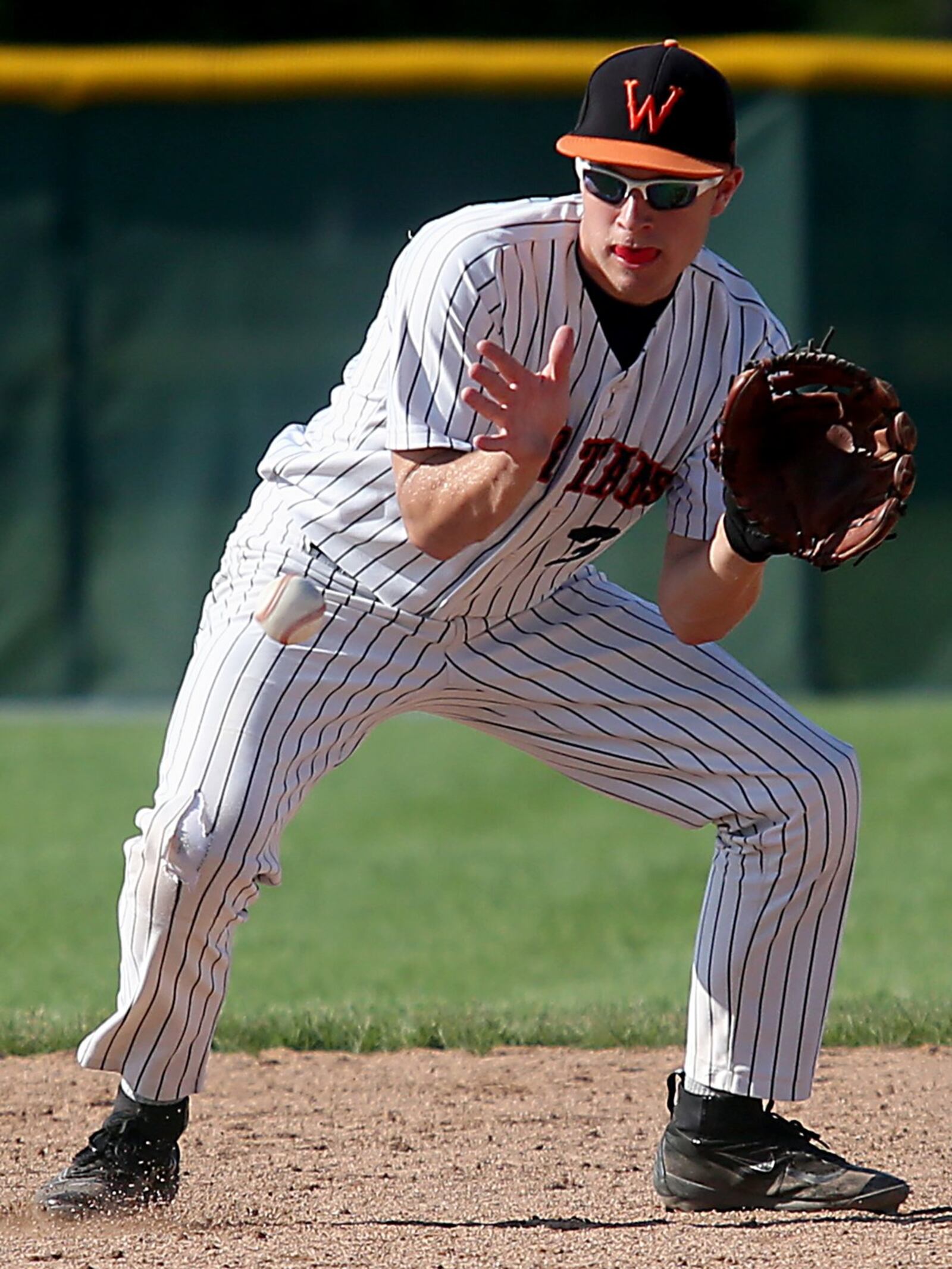 Waynesville shortstop Kyle Leis fields a Chaminade Julienne ground ball Friday during a Division II regional semifinal at Mason. CONTRIBUTED PHOTO BY E.L. HUBBARD