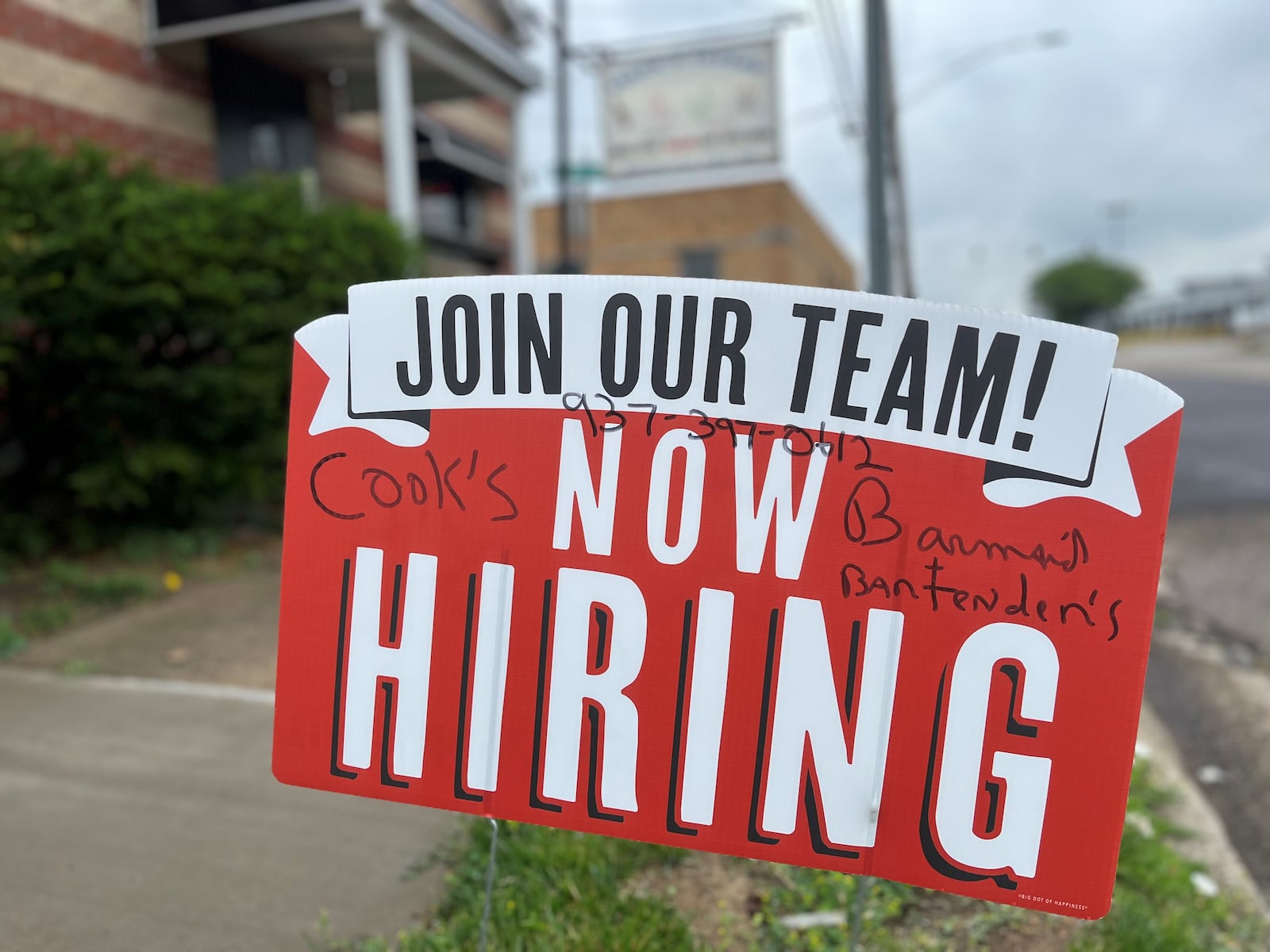 A now hiring sign outside of Frank's Tavern on the 1600 block of Webster Street in Dayton. The business is hiring cooks and bartenders. CORNELIUS FROLIK / STAFF