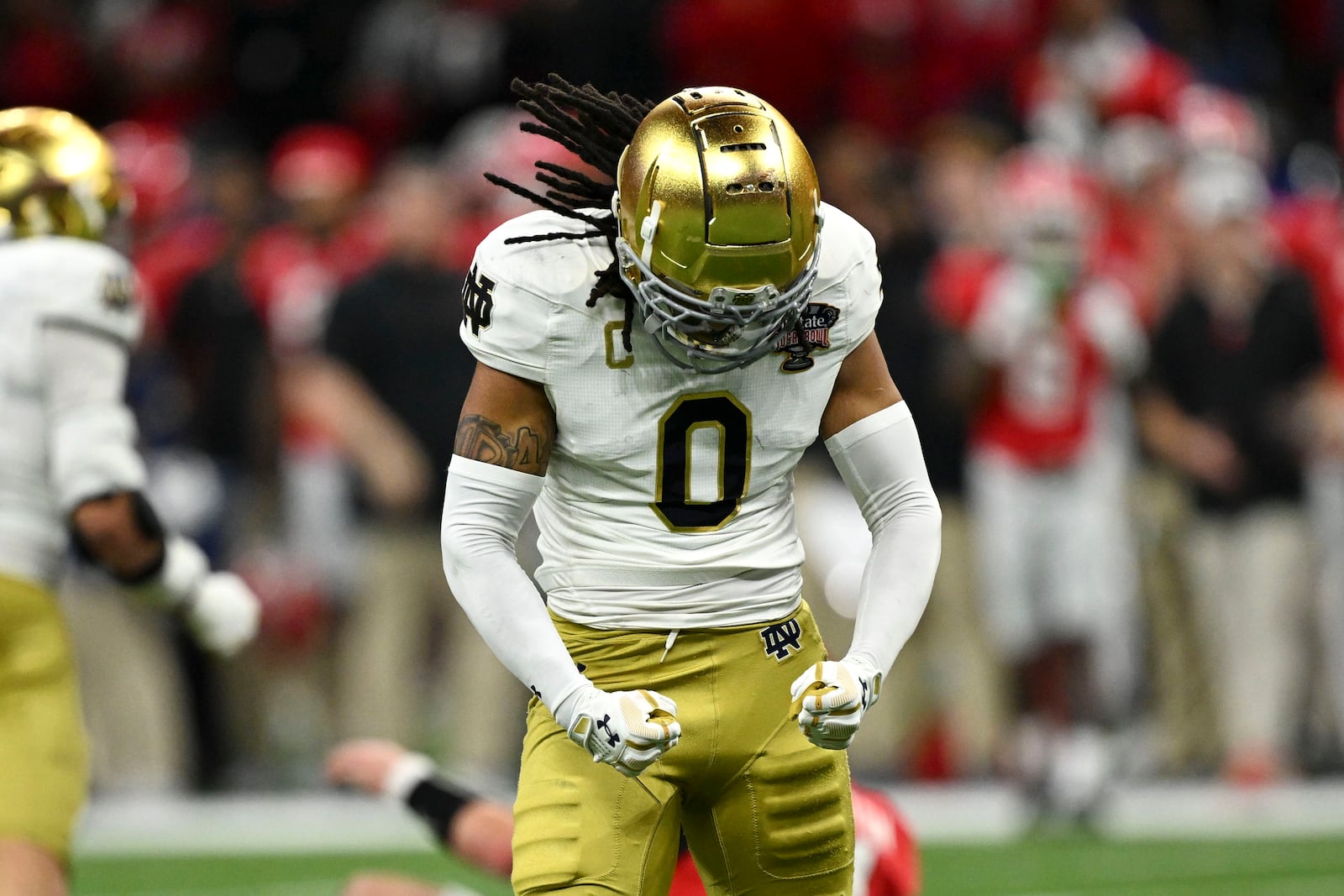 Notre Dame safety Xavier Watts celebrates after a defensive stop during the second half against Georgia in the quarterfinals of a College Football Playoff, Thursday, Jan. 2, 2025, in New Orleans. (AP Photo/Matthew Hinton)