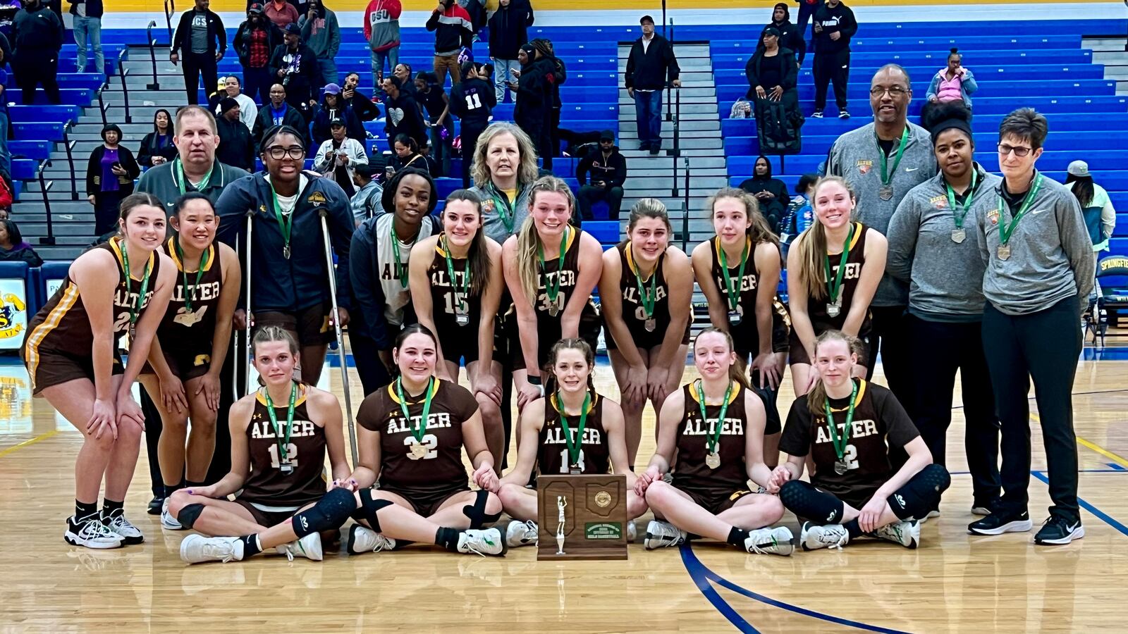 The Alter High School girls basketball program poses with the Division III regional runner-up trophy on Saturday afternoon at Springfield High School. The Nubians won 49-46. CONTRIBUTED PHOTO BY MICHAEL COOPER