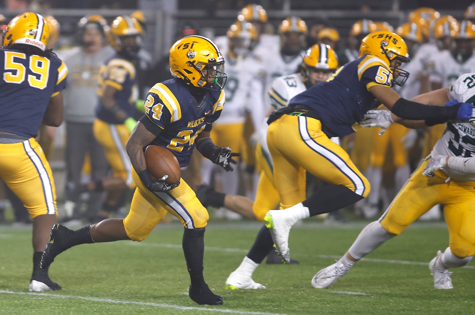 Springfield's Deontre Long carries the ball for the Wildcats during their game against St. Eds Friday, Dec. 1, 2023. BILL LACKEY/STAFF