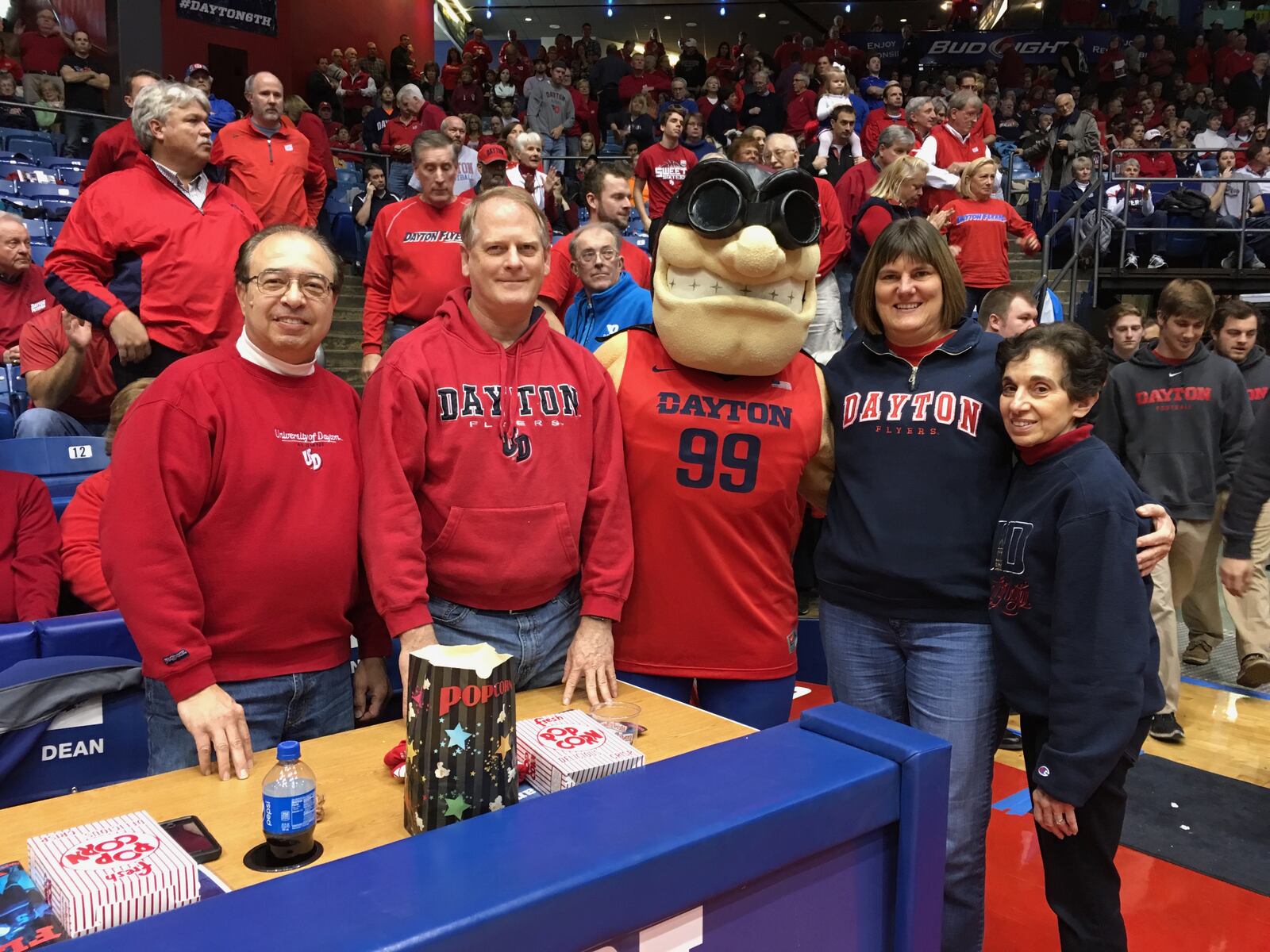 Bob Toia, left, stands with his neighbor Bryan, Rudy Flyer, his neighbor Julie and his wife Kathy, far right, at UD Arena in December 2015.