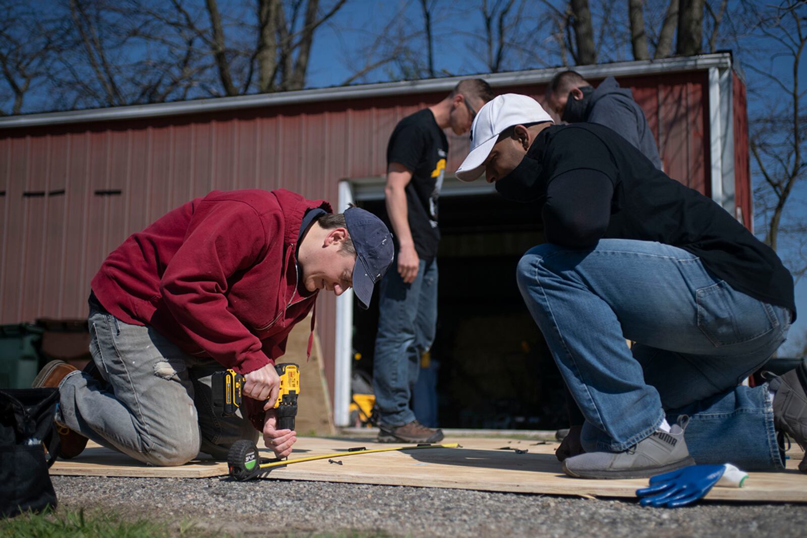 Air Force Life Cycle Management Center B-2 program office members Brant Dickerson (left) and Capt. Mister Raby build A-frames at a national historic landmark, the home of U.S. Army Colonel Charles Young April 19. U.S. AIR FORCE PHOTO/TECH. SGT. MATTHEW FREDERICKS