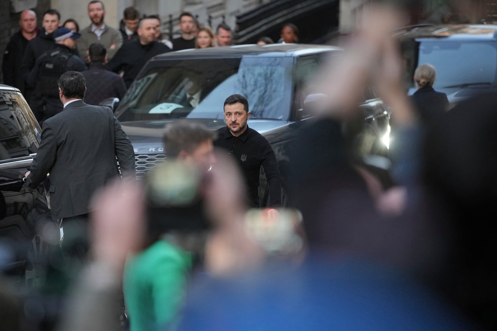 Ukraine's President Volodymyr Zelenskyy looks towards the waiting media as he arrives in Downing Street for a meeting with Britain's Prime Minister Keir Starmer in London, Saturday, March 1, 2025. (AP Photo/Kin Cheung)