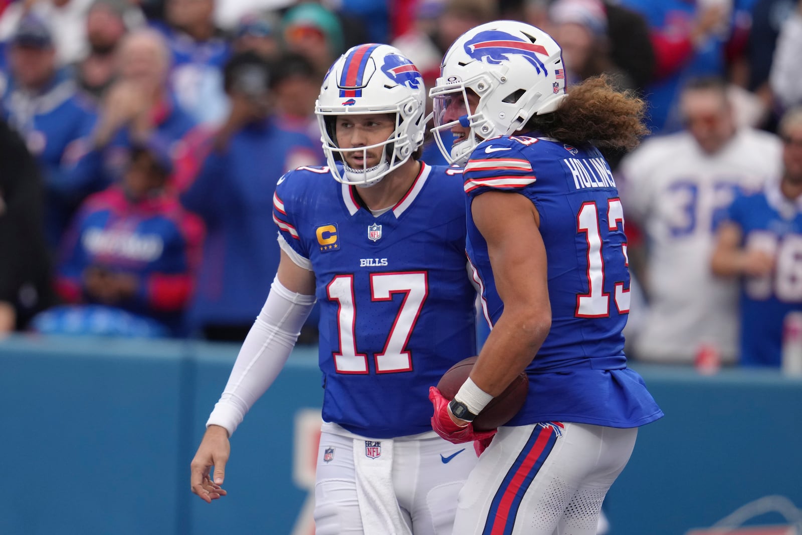 Buffalo Bills quarterback Josh Allen (17) congratulates wide receiver Mack Hollins (13) after Hollins scored a touchdown during the second half of an NFL football game against the Miami Dolphins, Sunday, Nov. 3, 2024, in Orchard Park, N.Y. (AP Photo/Gene Puskar)