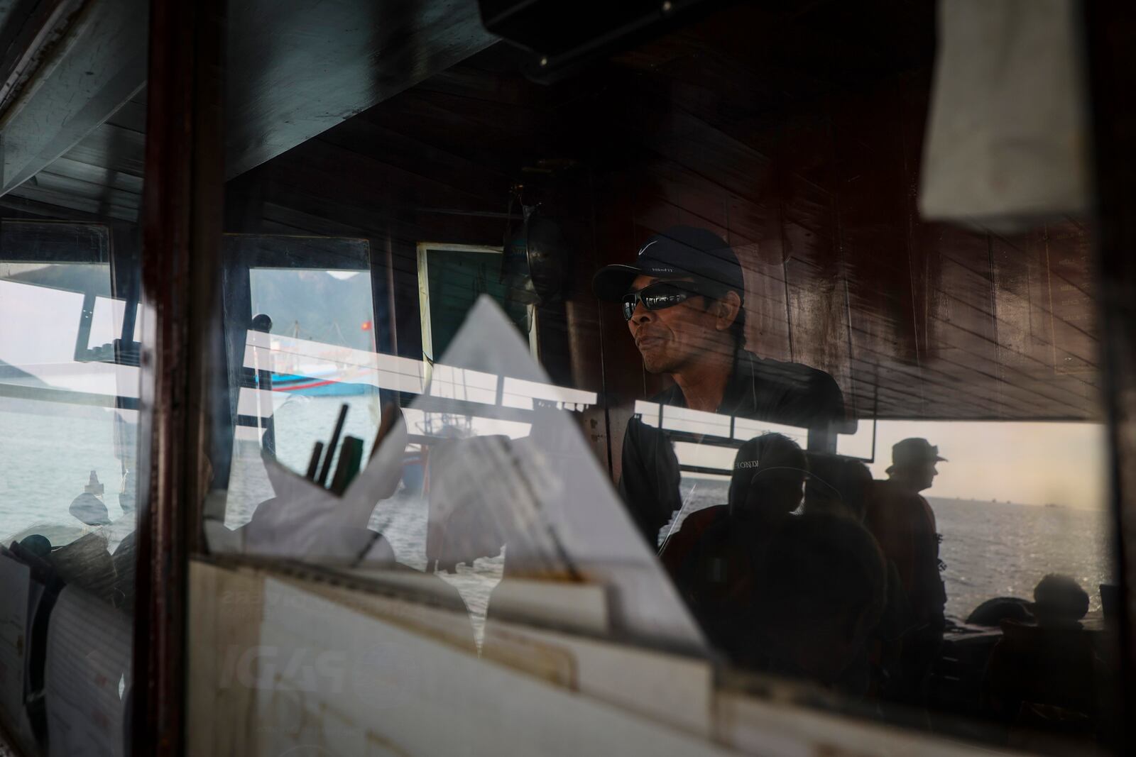 Nguyen Tuan Hai drives Rainbow Diver's boat to Madonna Rock, Feb. 7, 2025, in Nha Trang, Vietnam. (AP Photo/Yannick Peterhans)