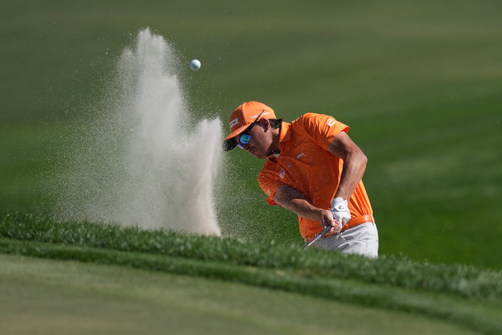 Rickie Fowler hits out of a greenside bunker on the second hole during the final round of the Cognizant Classic golf tournament, Sunday, March 2, 2025, in Palm Beach Gardens, Fla. (AP Photo/Rebecca Blackwell)